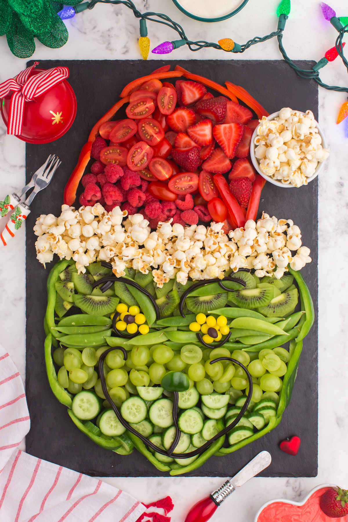 Grinch fruit tray made with fruits and vegetables