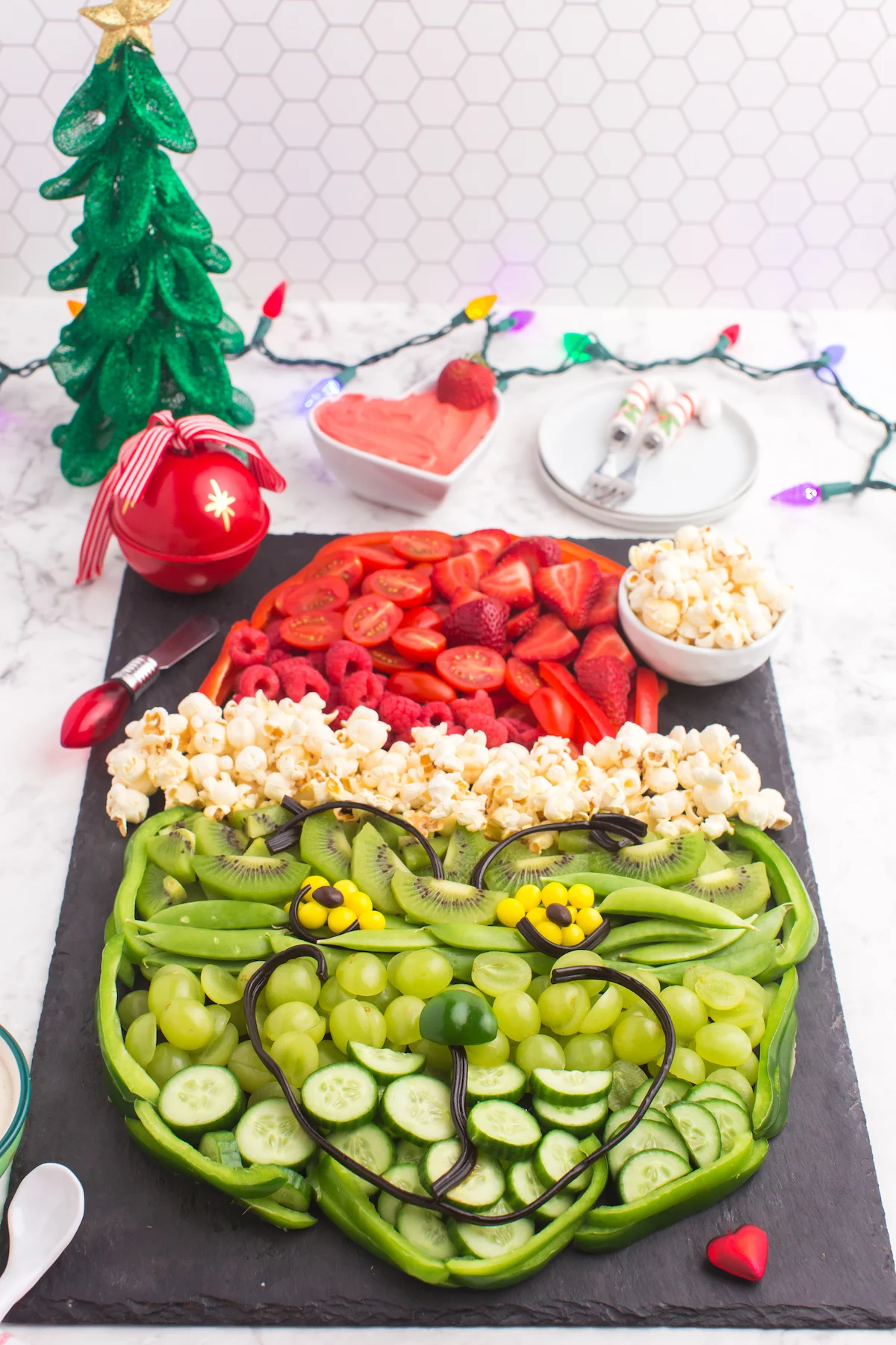 grinch made from fruit and vegetables with Christmas decorations