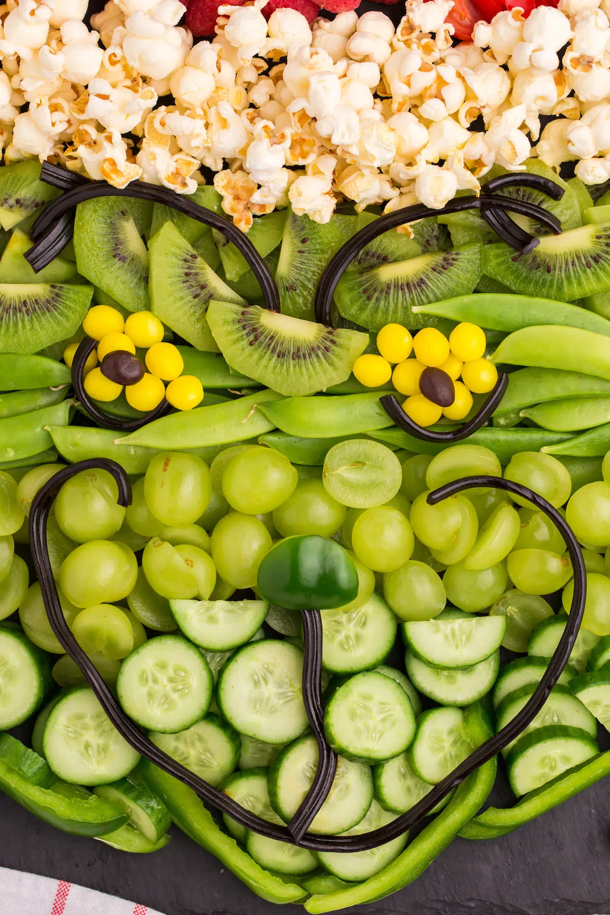 close up of grinch face of Christmas fruit platter