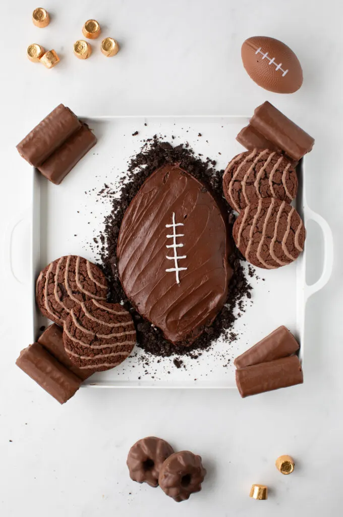 adding sweets around the football dessert board