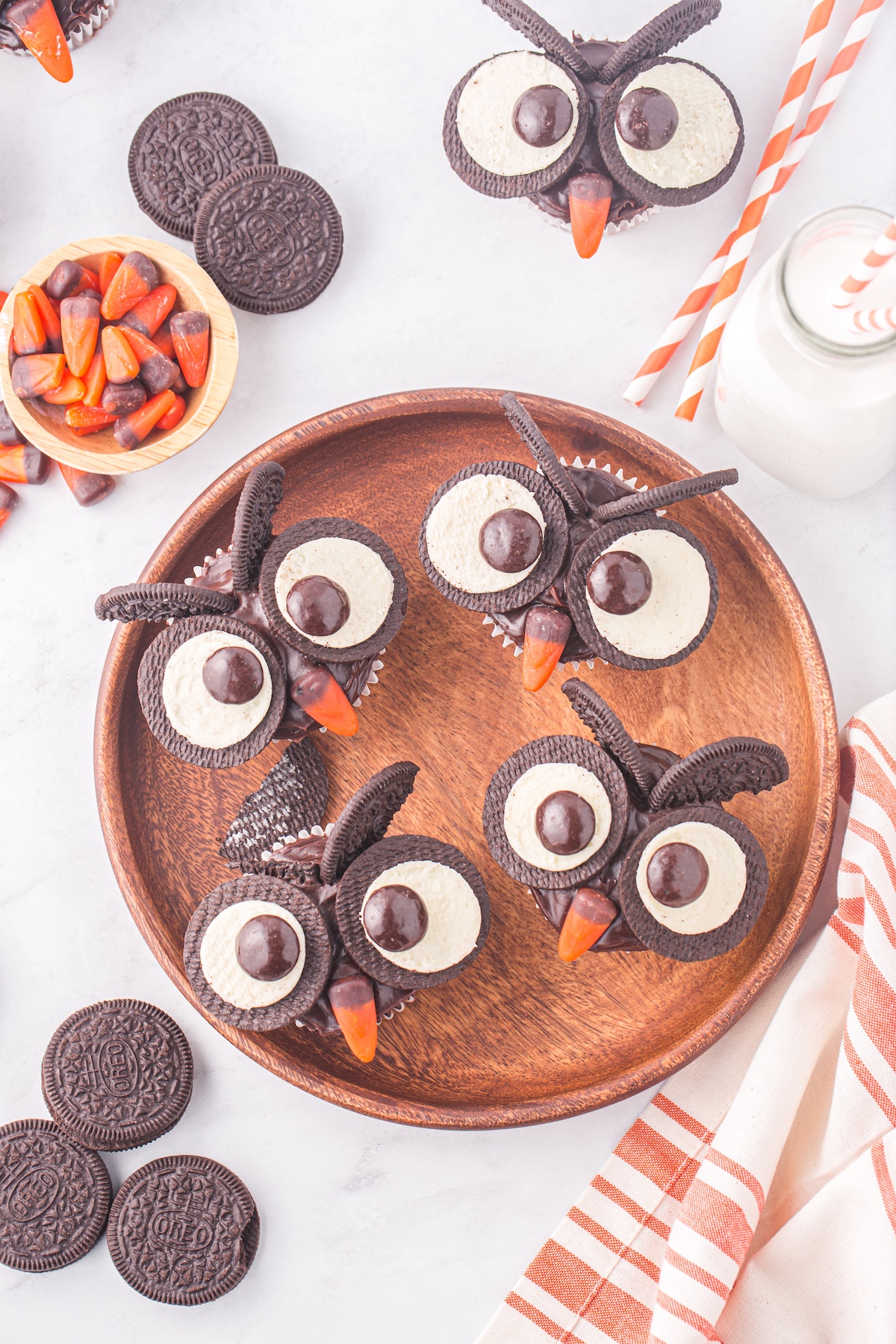 owl cupcakes on a wooden board