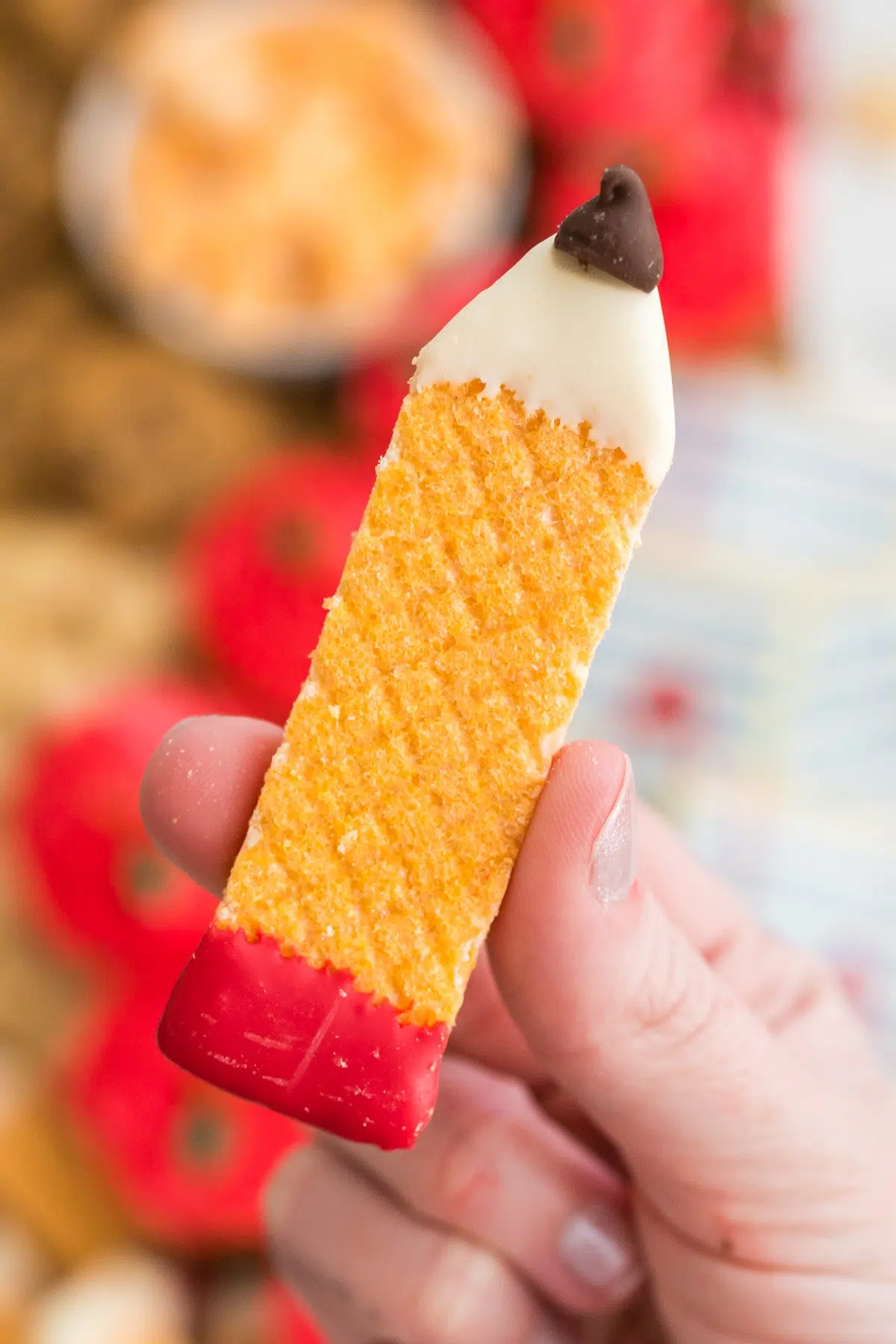 pencil cookie in a hand