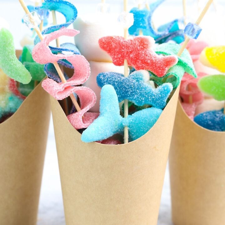 Beach Candy Charcuterie Cups with shark candies in a brown cup