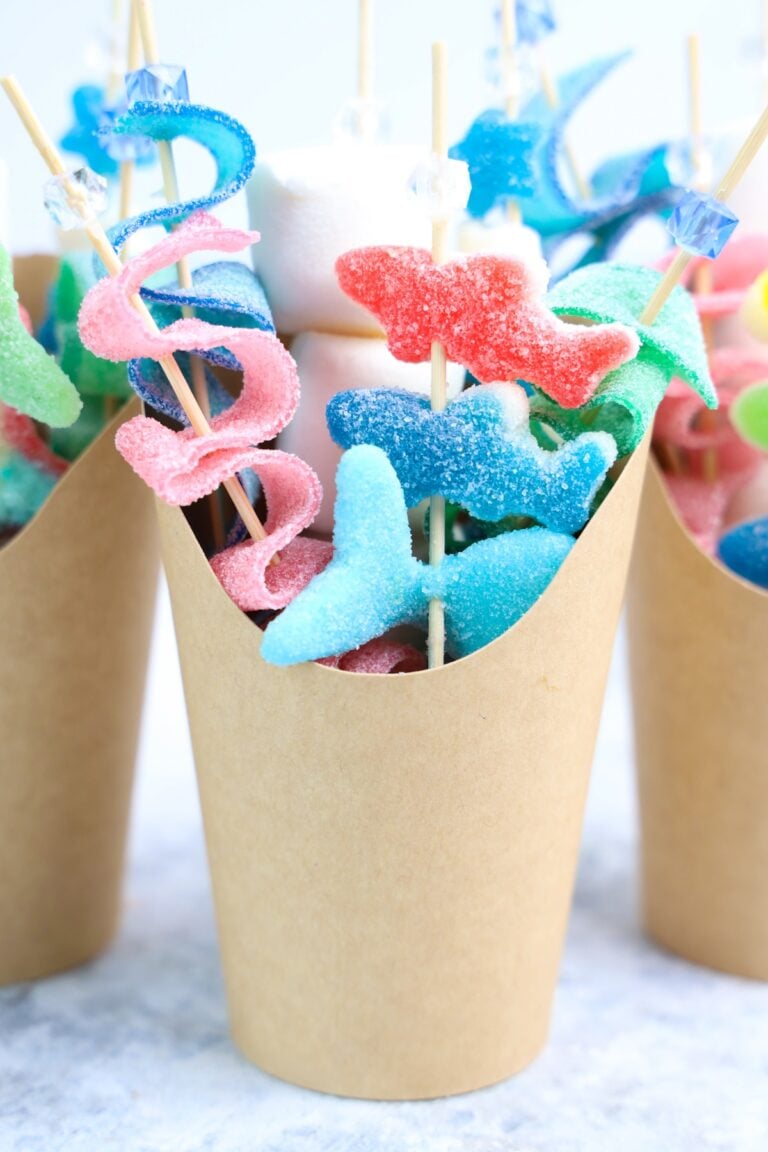 Beach Candy Charcuterie Cups with shark candies in a brown cup