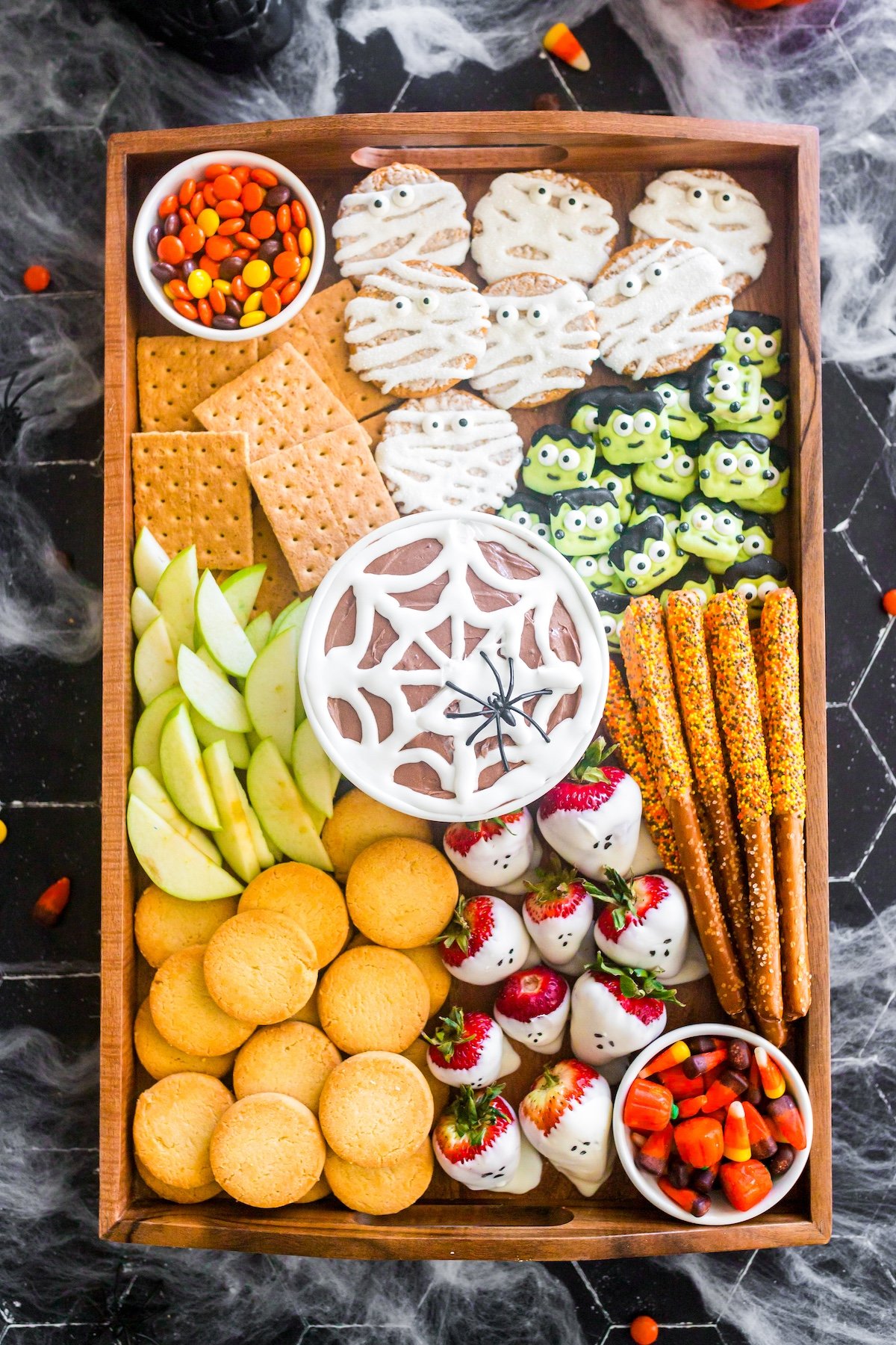 Halloween dessert board on a brown tray