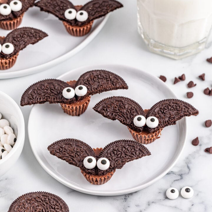 Oreo bat cookies on a white plate