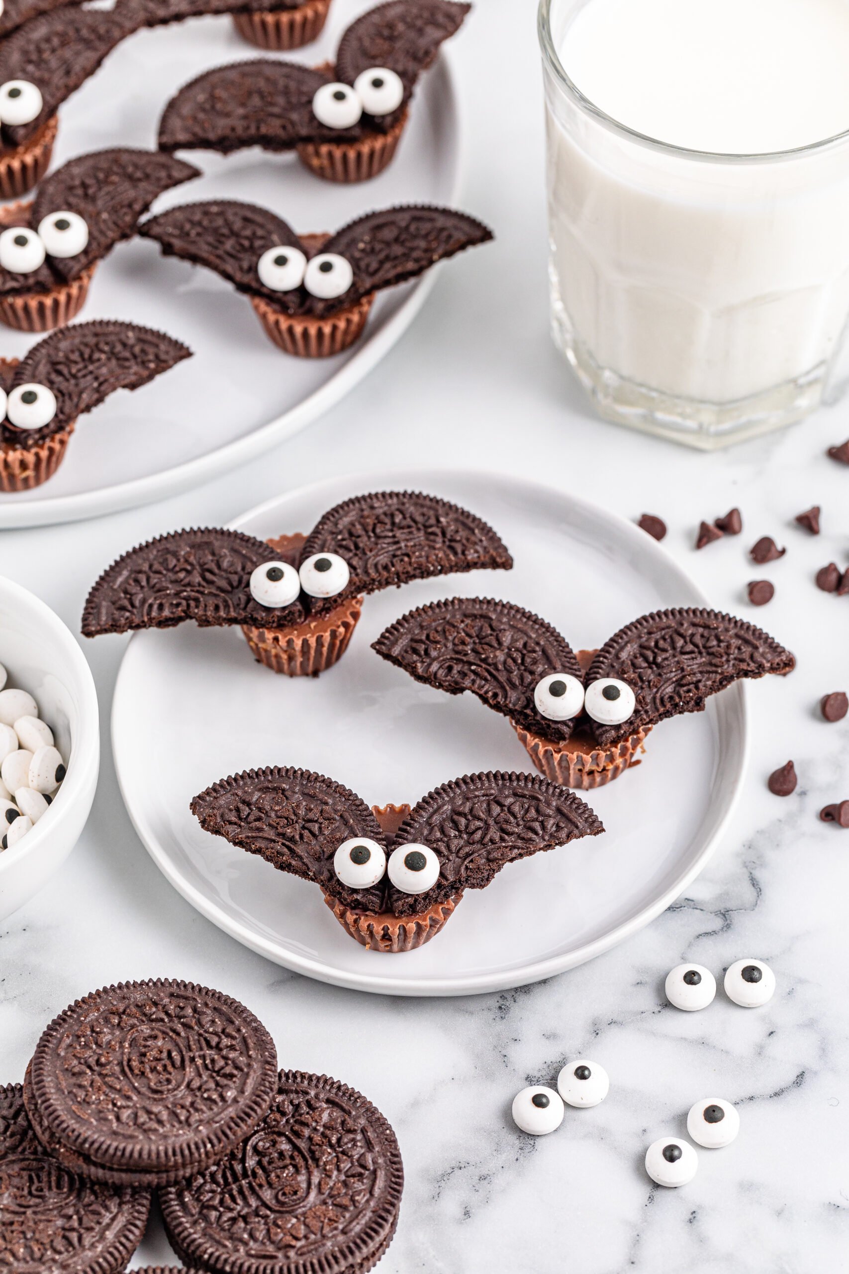 Oreo bat cookies on a white plate