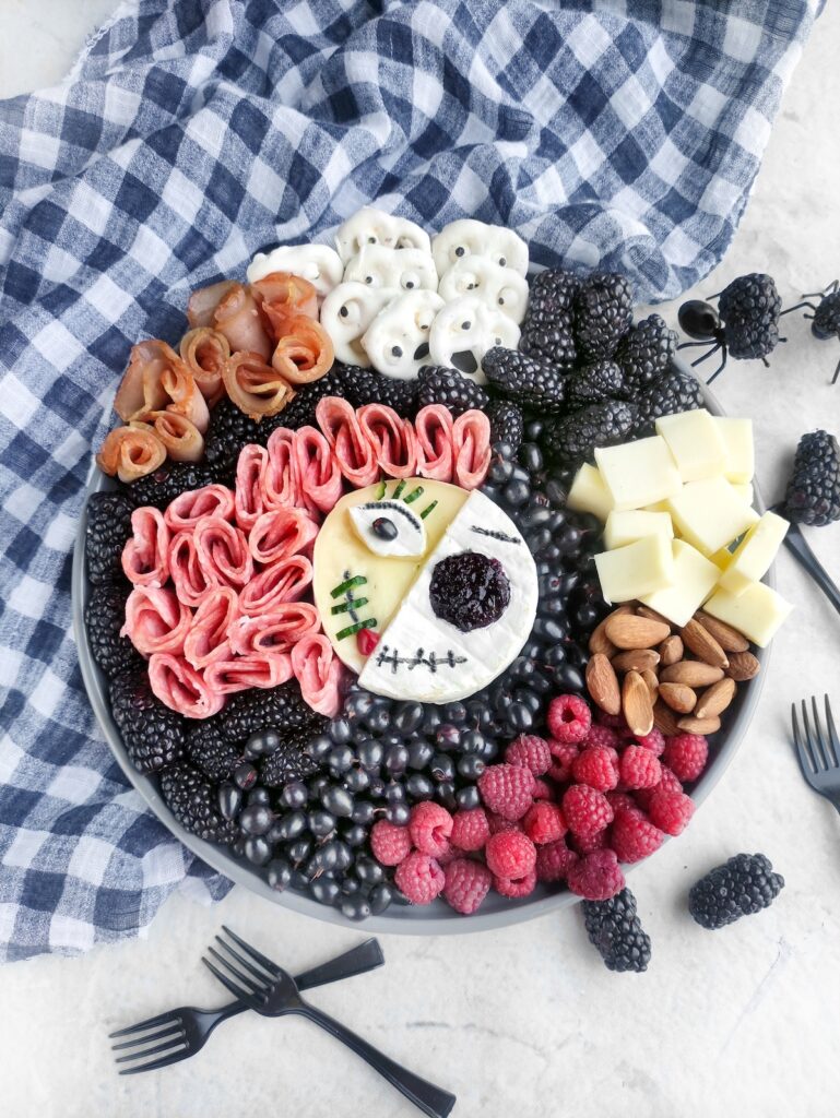 Jack Skellington Charcuterie Board with a blue checkered napkin