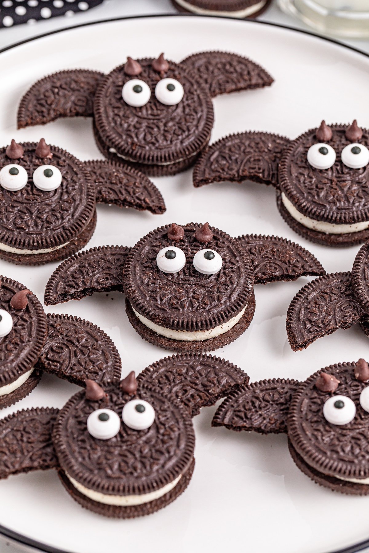 Oreo bat cookies on a white plate