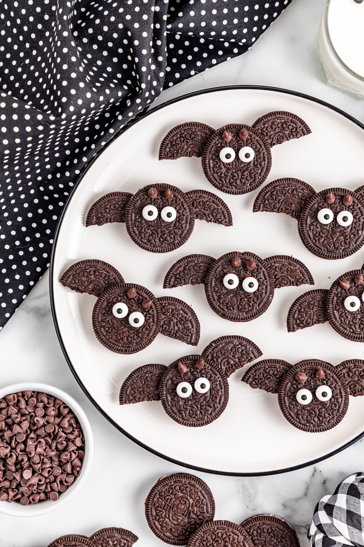 Oreo bat cookies on a white plate