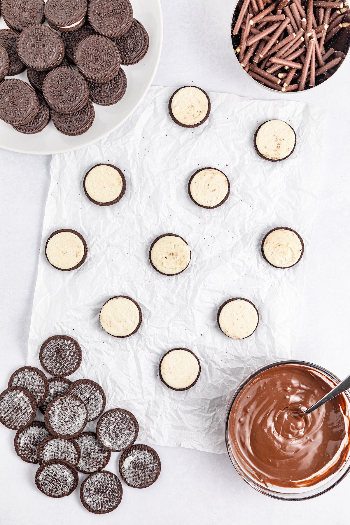 Oreo cookies spread out on parchment paper