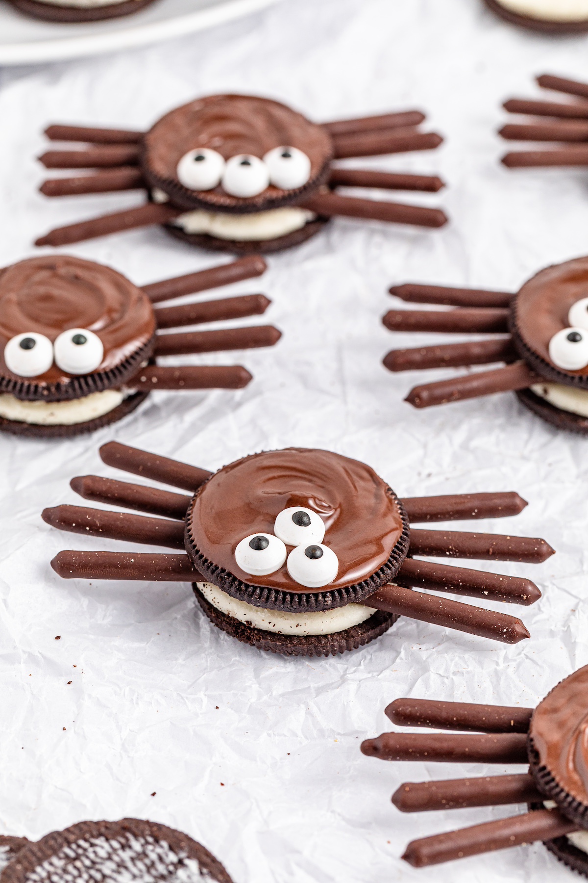 oreo spider cookies on a white plate