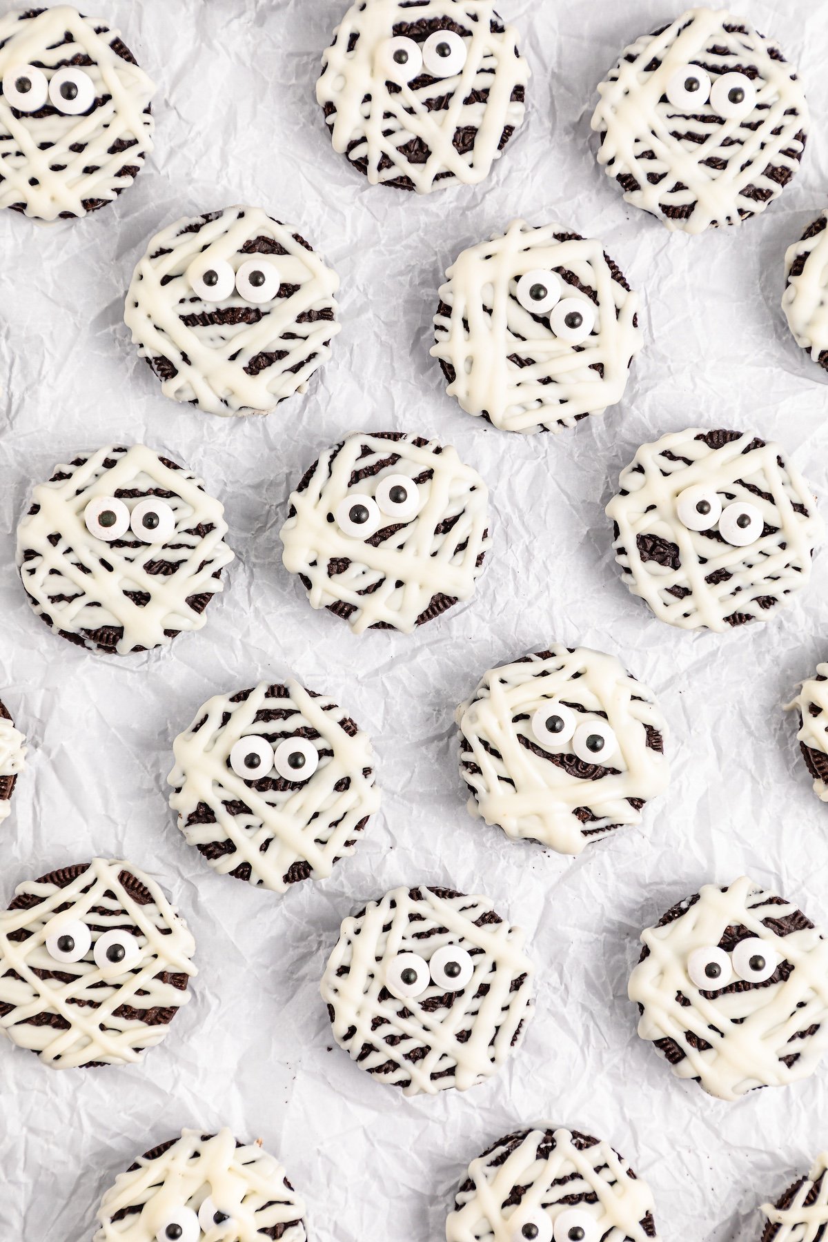 oreo cookies with white chocolate strands over it