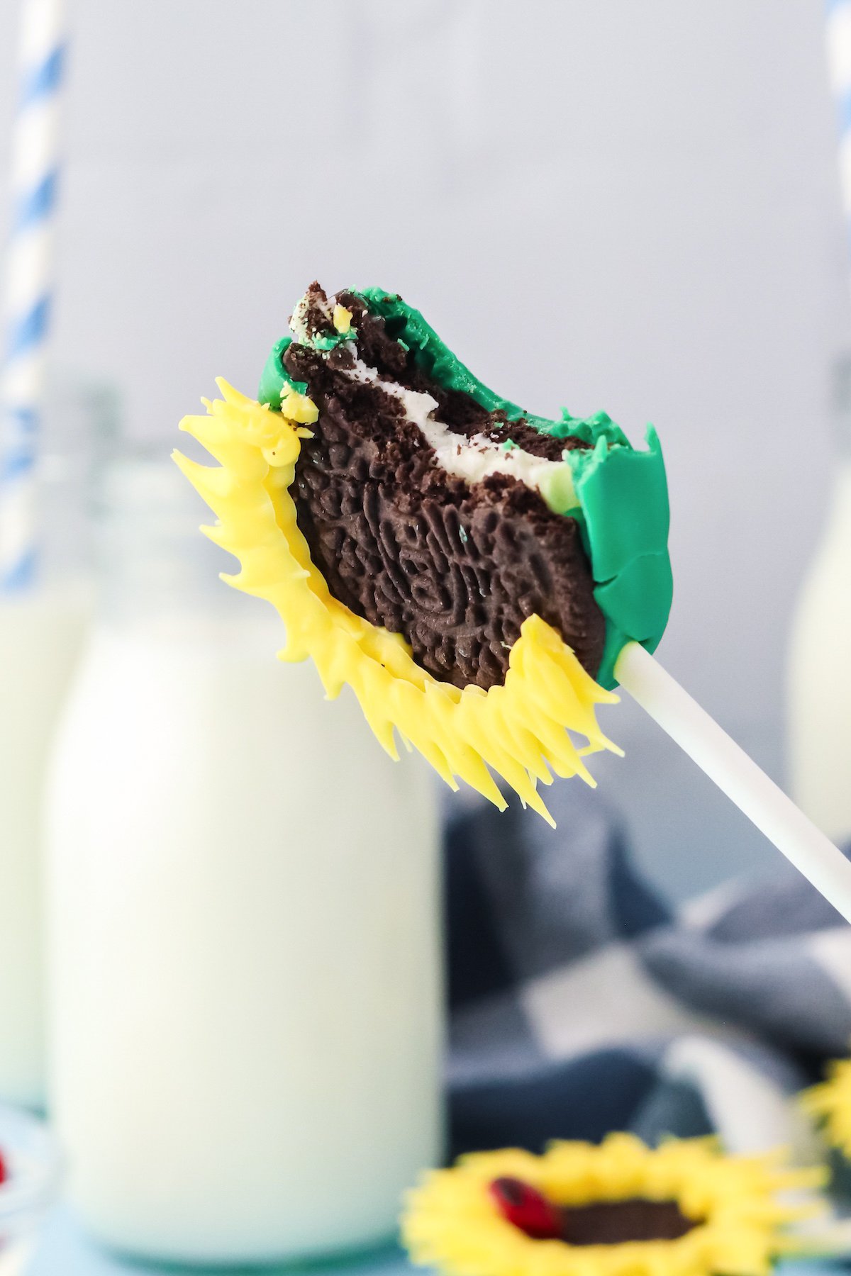 an oreo cookie pop with a bite out