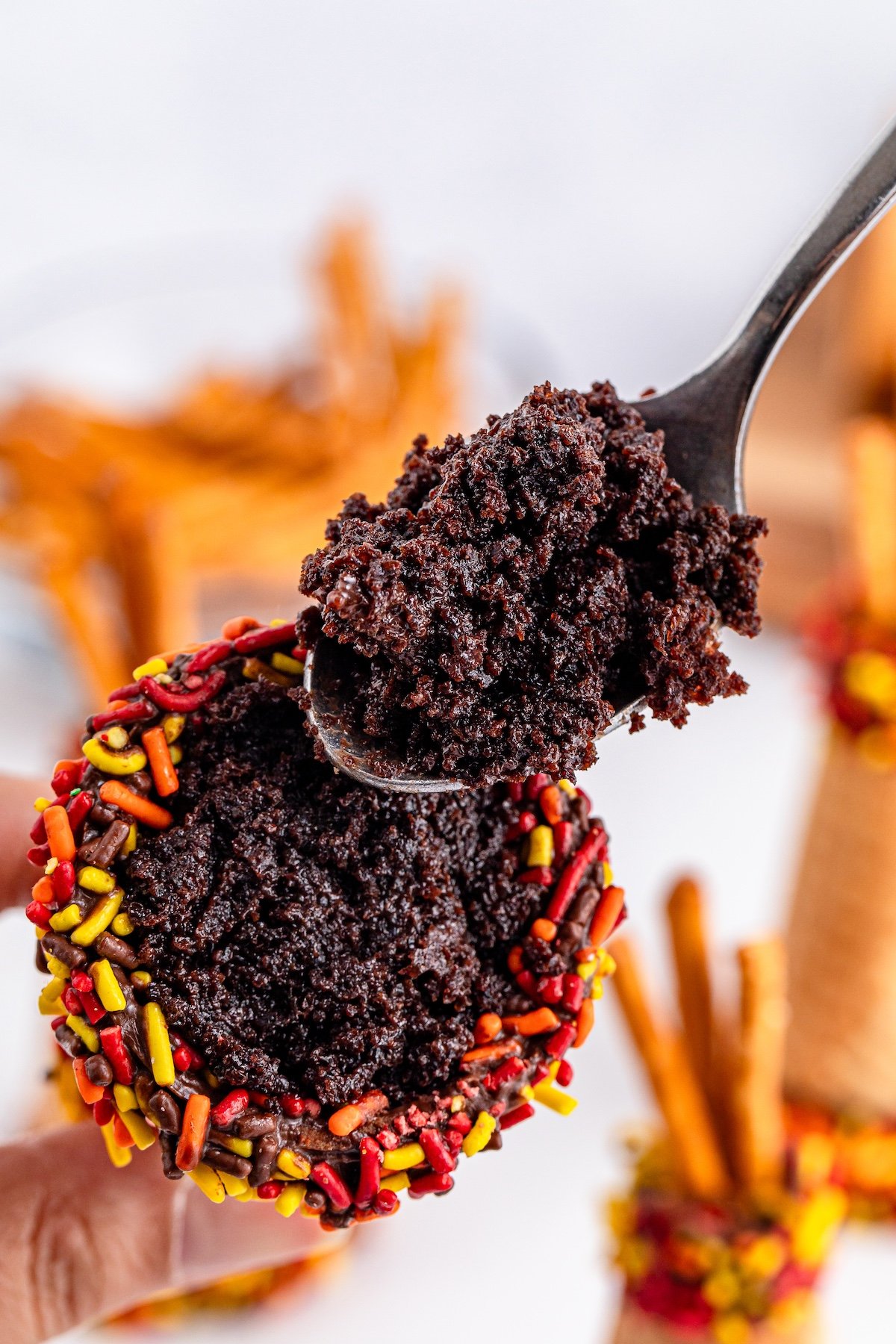 adding cake into the cones