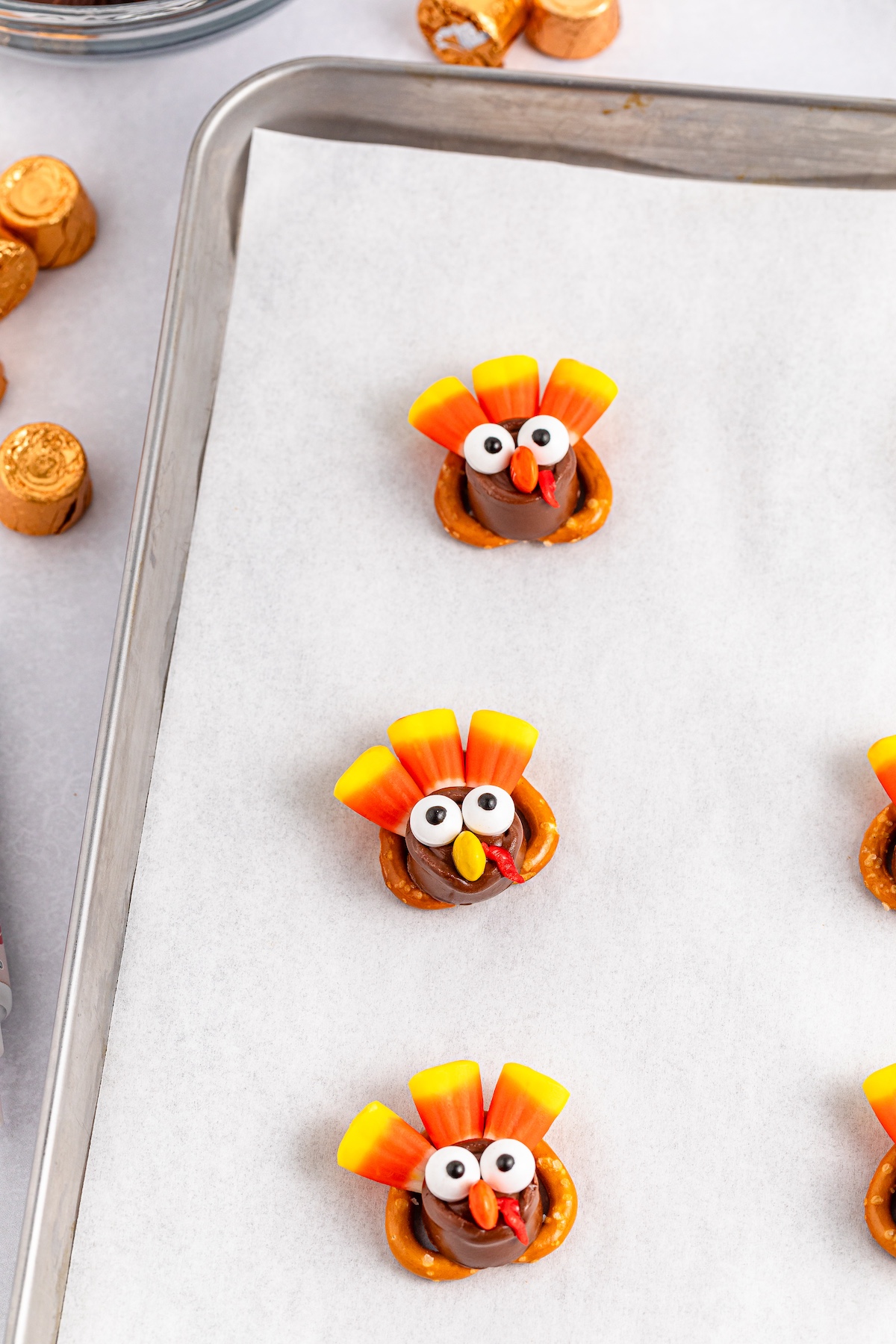 mini pretzel turkeys on a cookie sheet