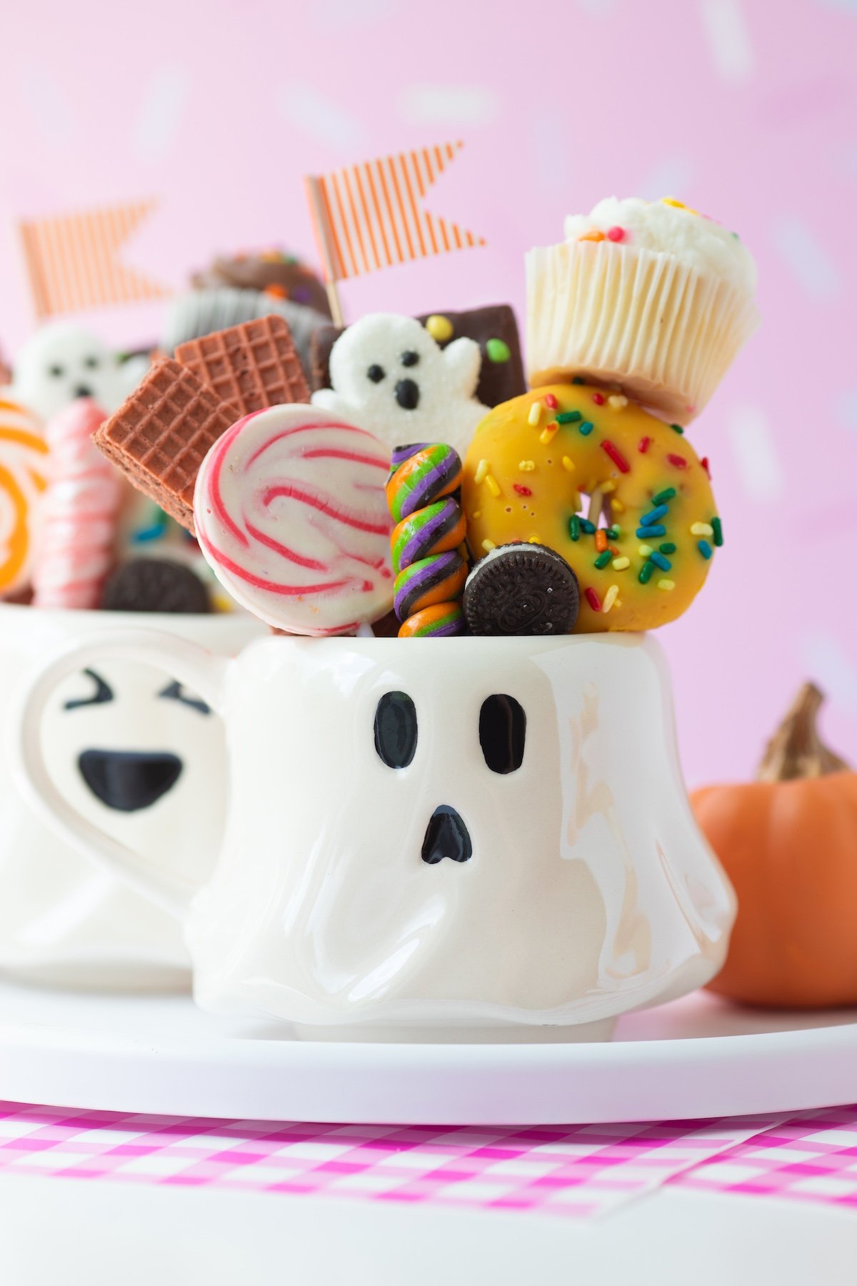 halloween dessert mugs filled with mini treats and candies. Adorable ghost mug.