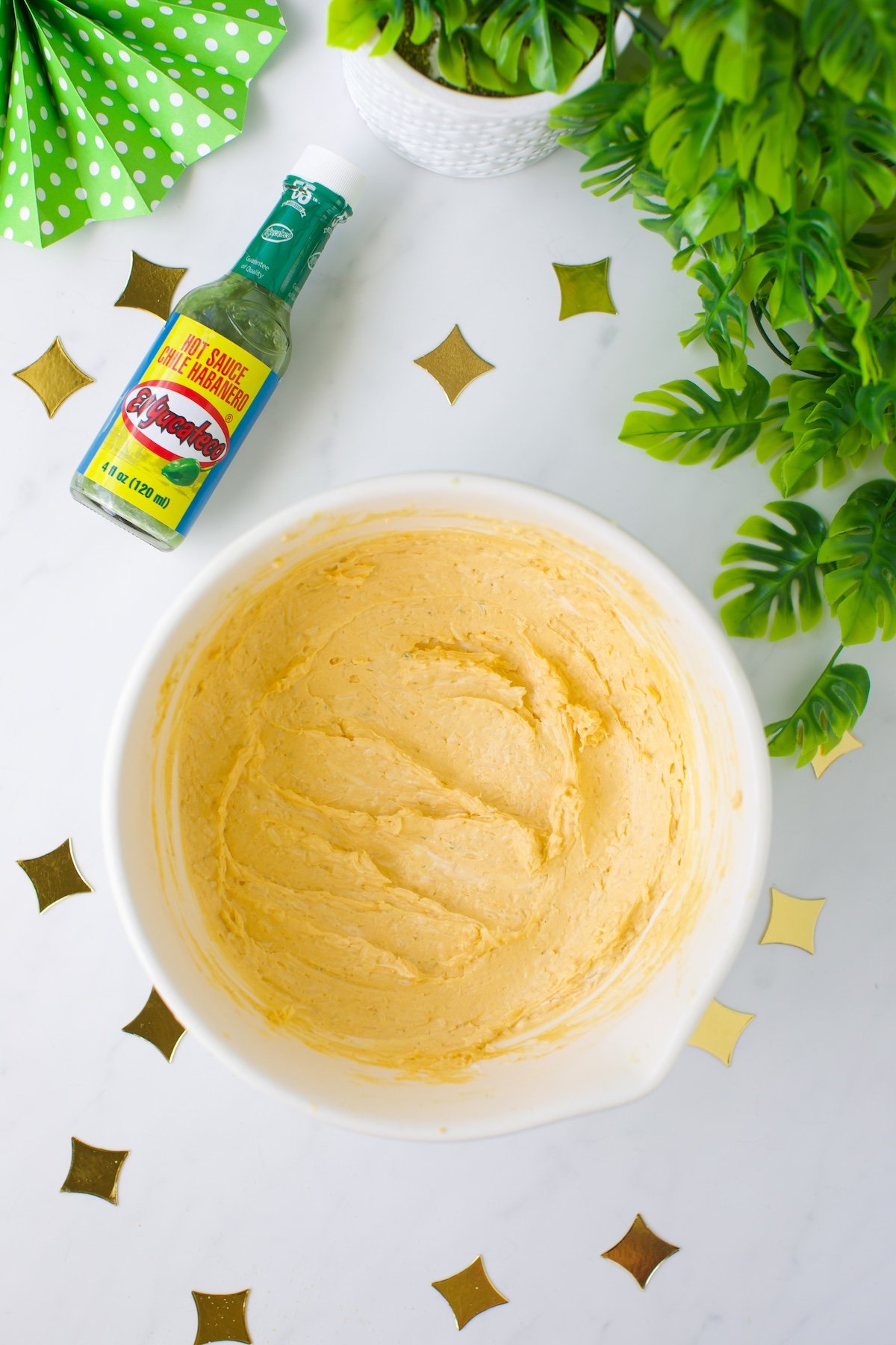 over the top view of cheeseball mixture in a mixing bowl