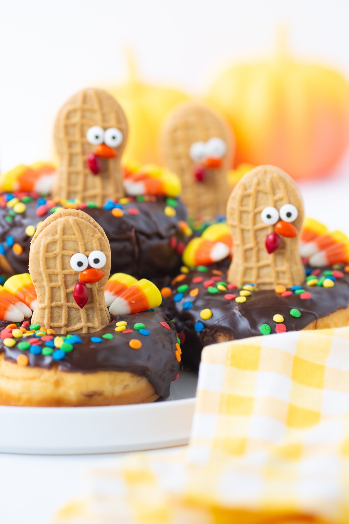 cute nutter butter turkey donuts up close. donuts that look like turkeys made with candies and cookies.