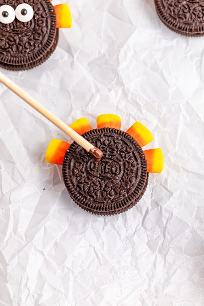 adding chocolate to the cookie top