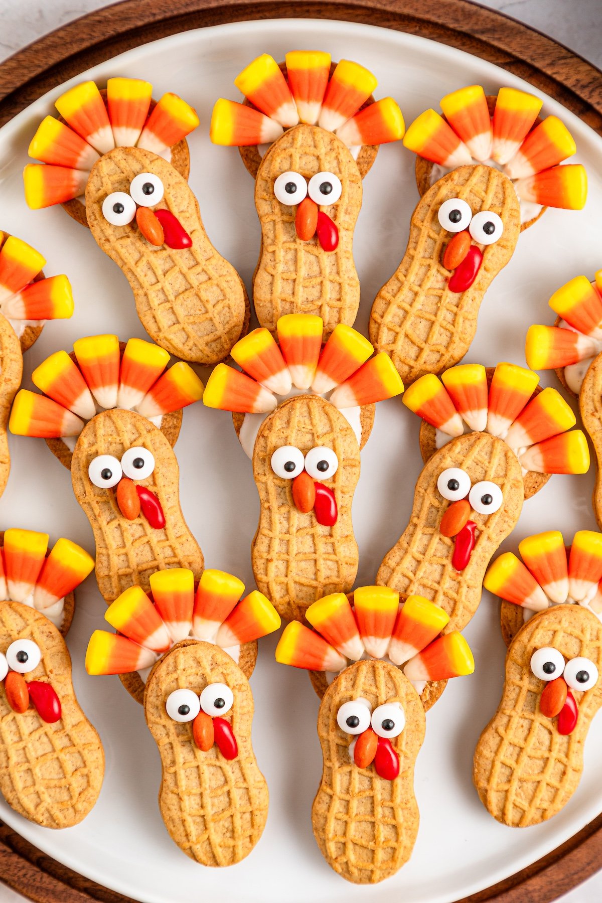 nutter butter turkey cookies on a white plate