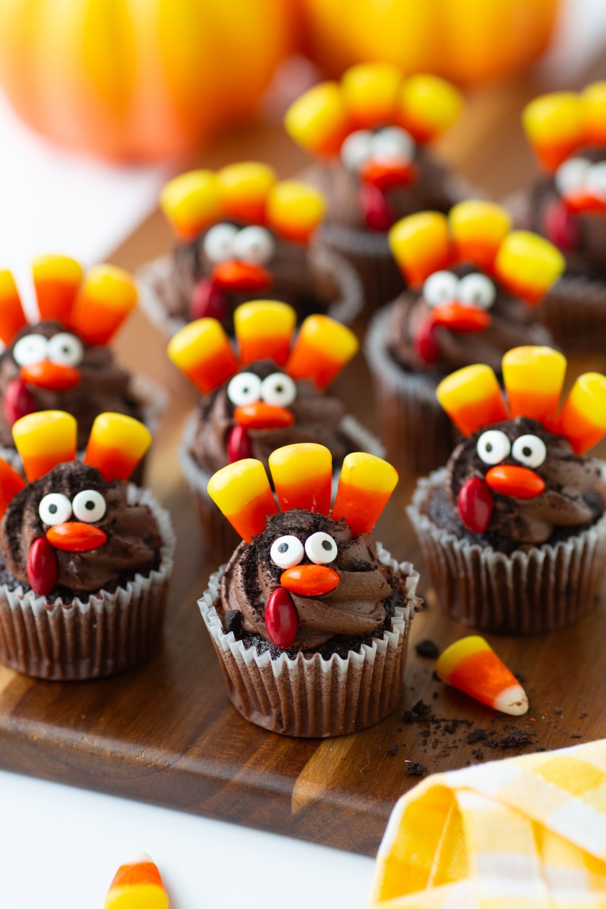 mini turkey cupcakes set on a wooden tray