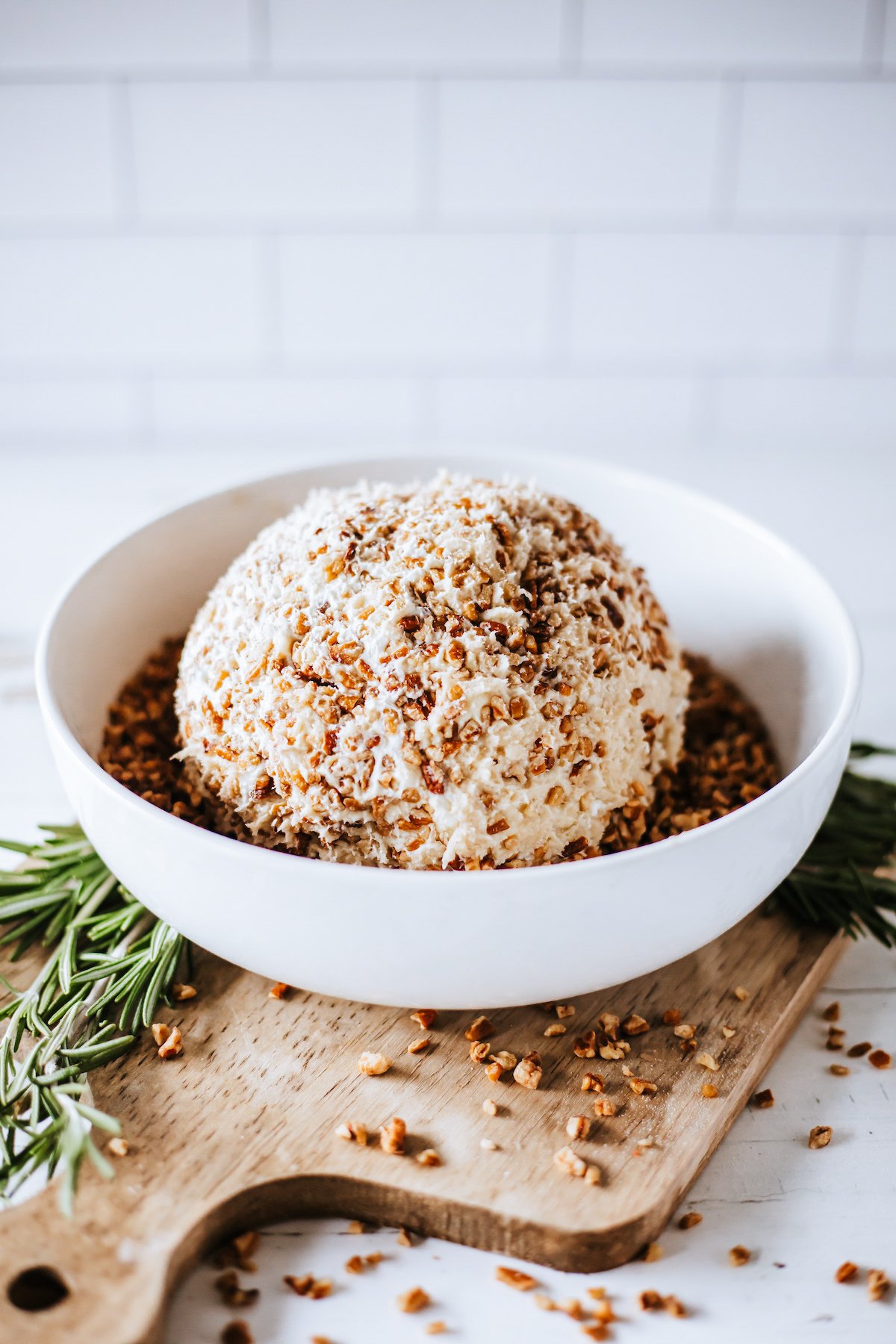 cheese in a white bowl with pecans