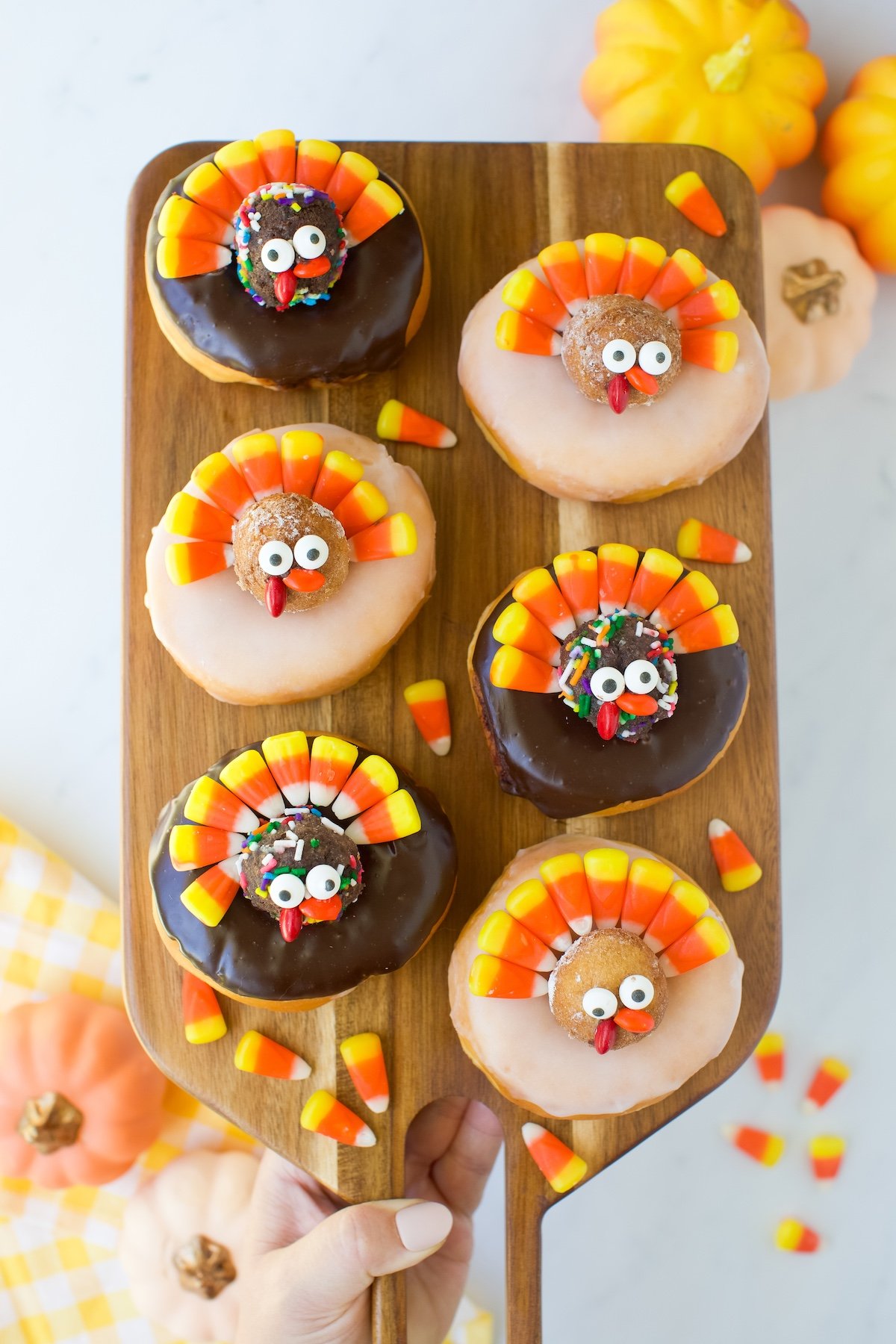 Candy Corn Turkey Donuts chocolate frosted and glazed on a tray.