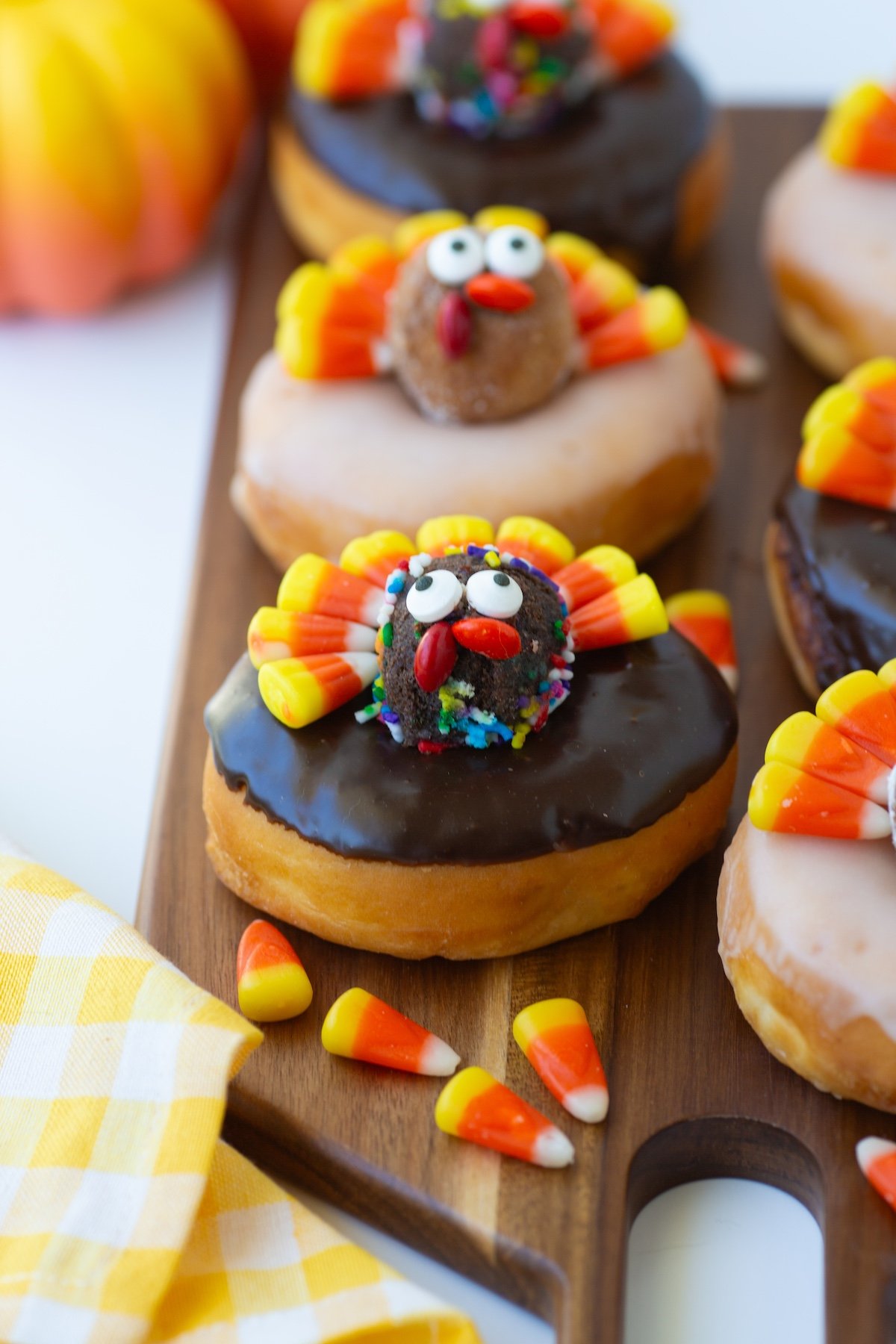 Adorable Candy Corn Turkey Donuts with chocolate glaze and donut holes.