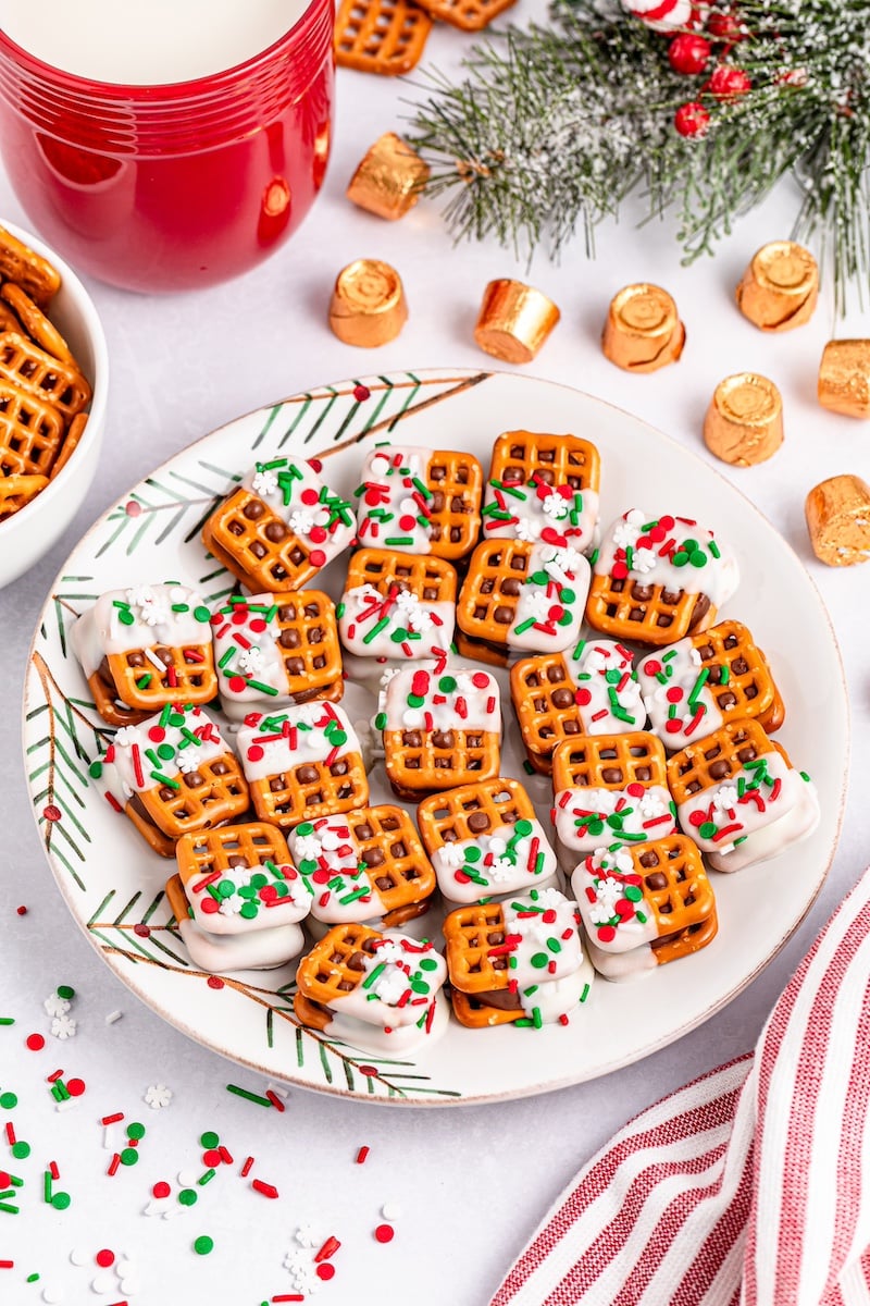 Christmas pretzel sandwiches on a white plate