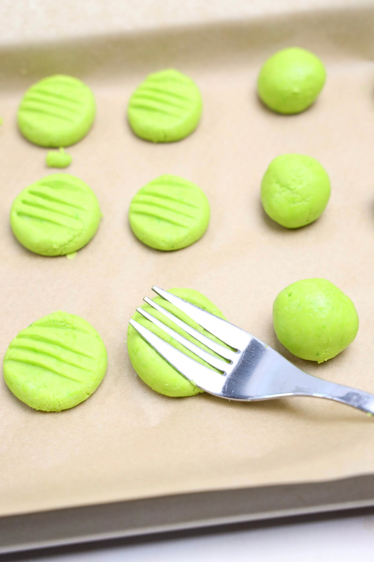 mints being flattened with a fork