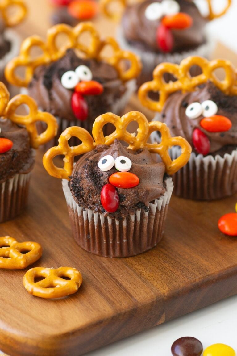 up close view of mini thanksgiving cupcakes made with mini pretzel twists, candy eyes and candies