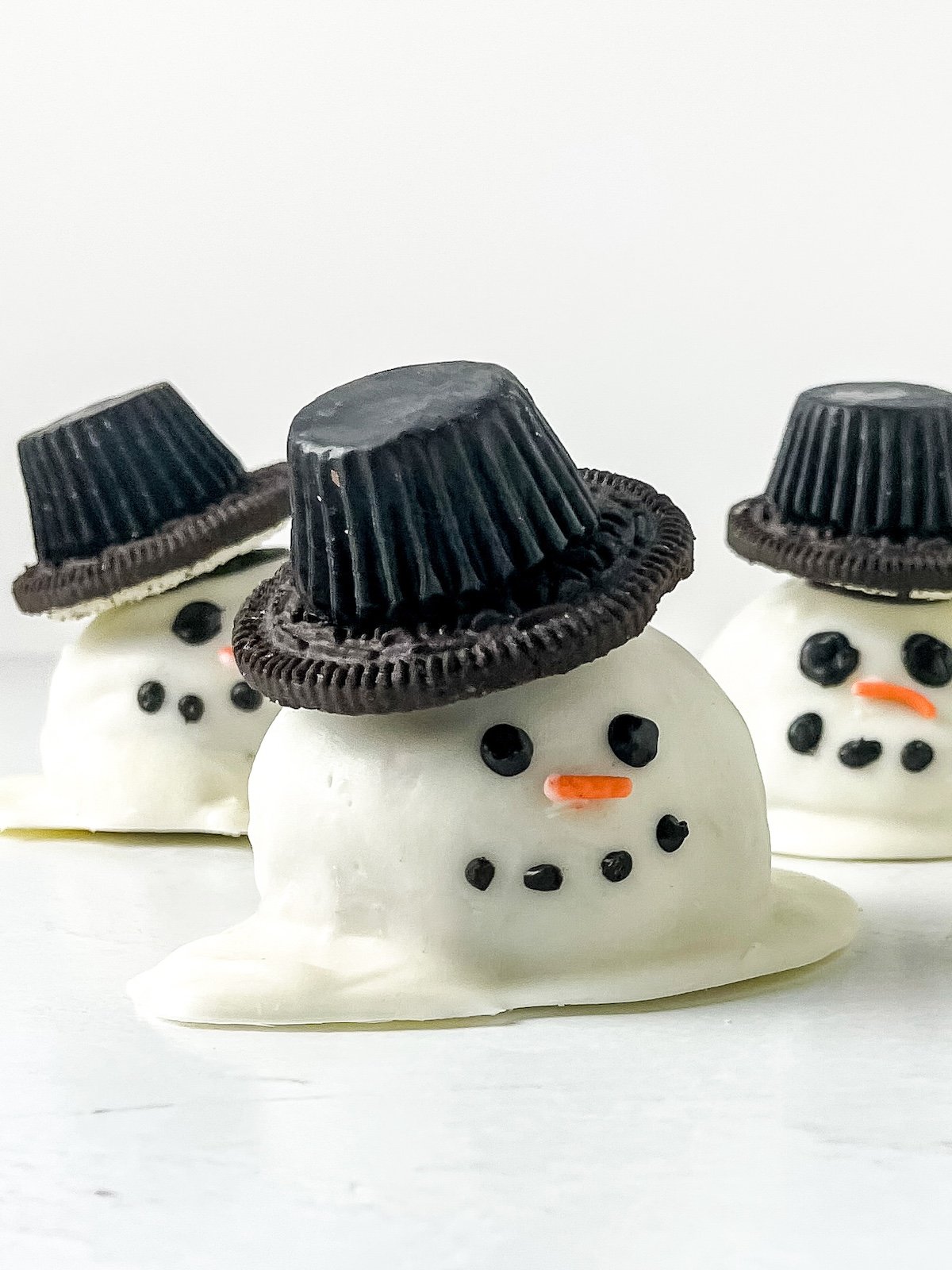 snowman truffles with top hats. cute recipe made with cookie dough.