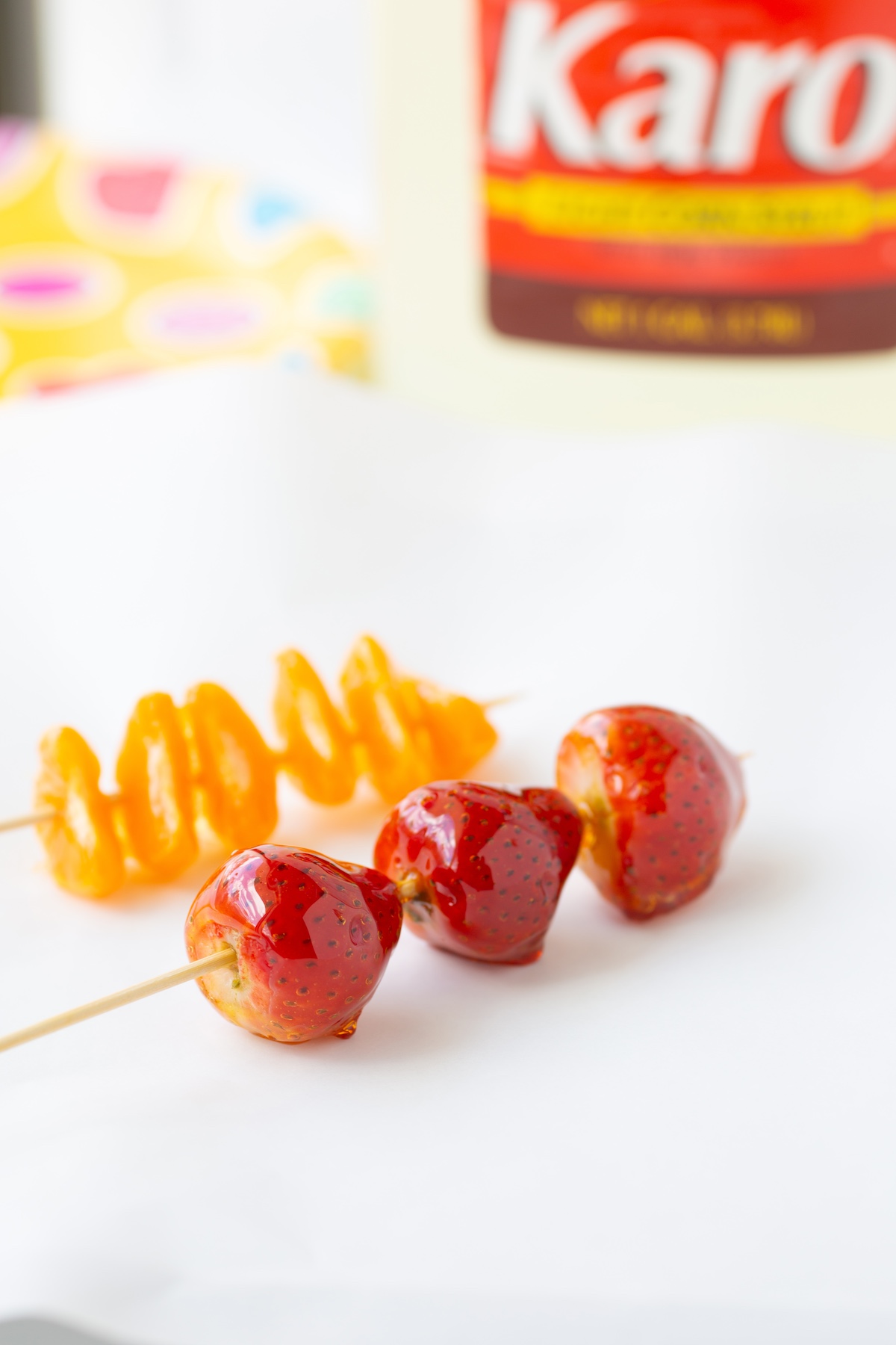 skewered tanghulu, candied fruit snacks. strawberries, clementines.