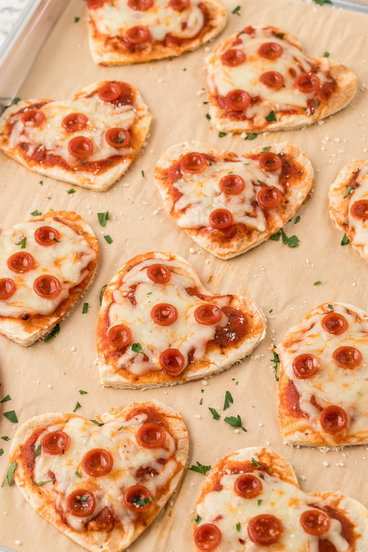 heart pizzas on a brown tray