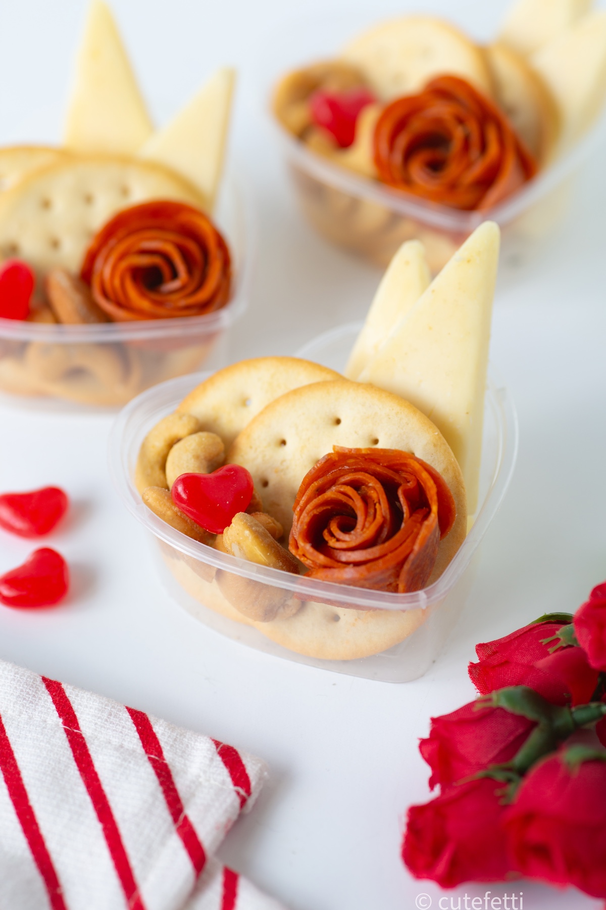 simple charcuterie heart snack box with pepperoni rose, crackers and cheese