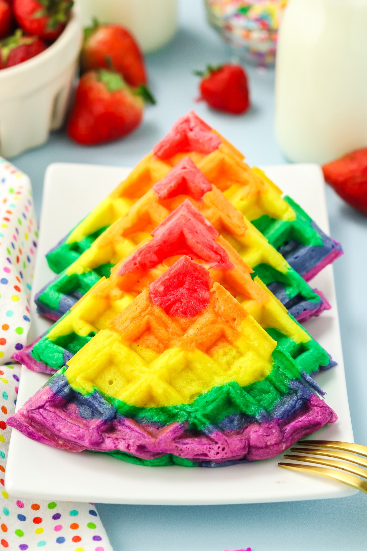 cut rainbow waffles on a plate