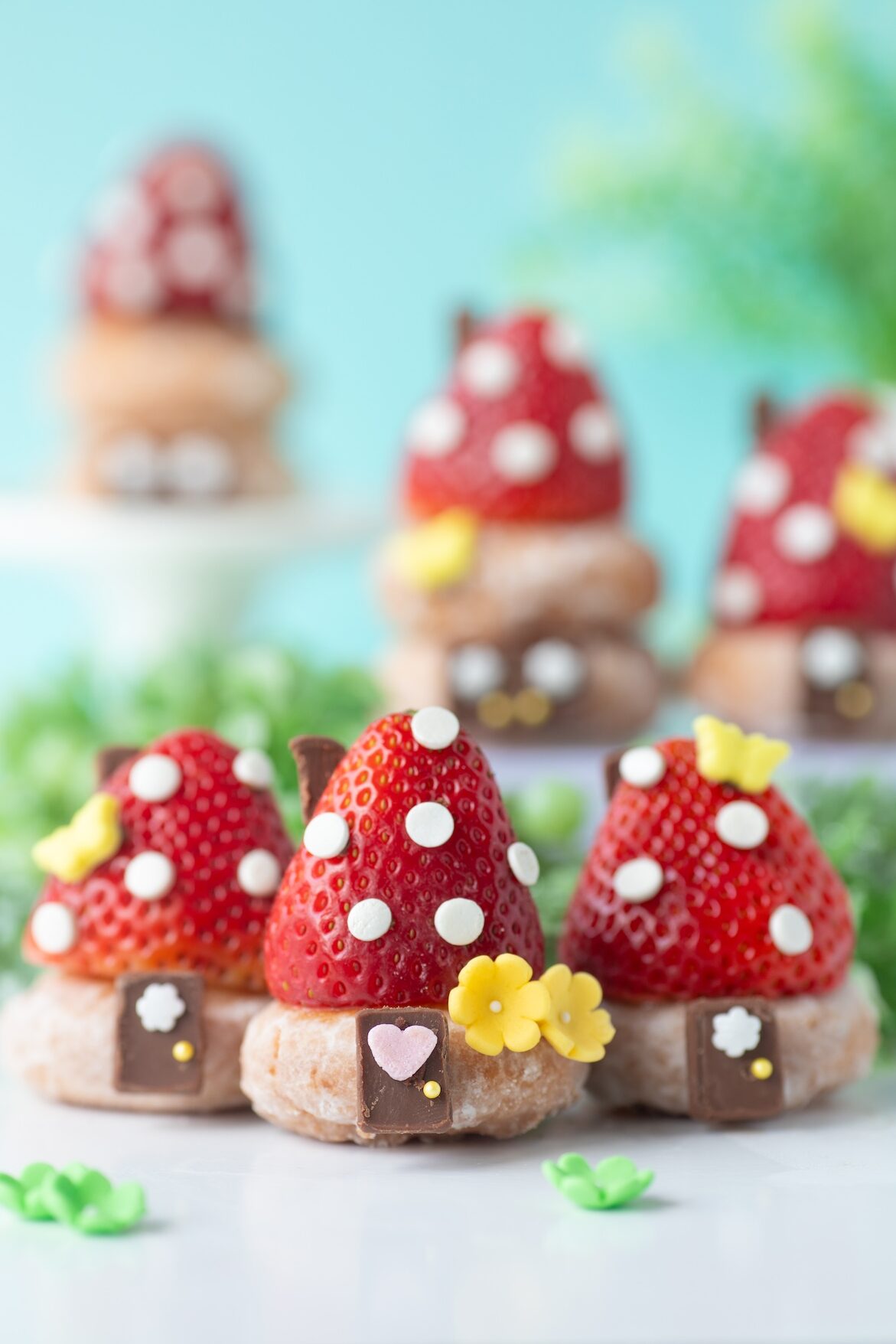 Smurf Hut Mini Donuts made with strawberries and sprinkle.s