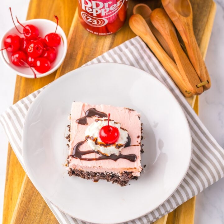 Dr. Pepper Poke Cake on a white plate