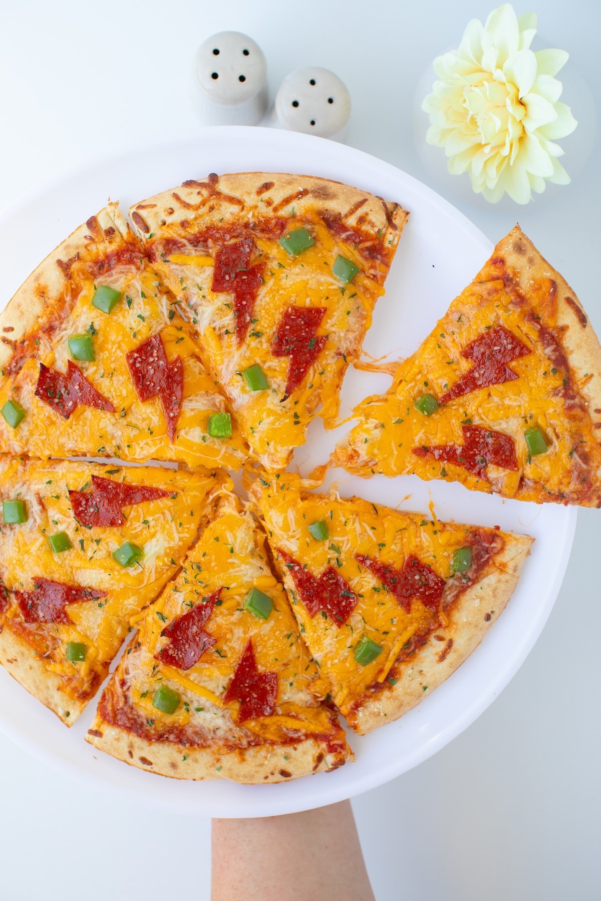 whole cheese pizza with lightning shaped pepperonis.