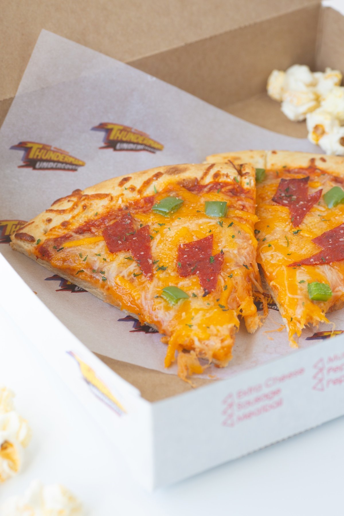 Lightning bolt pizza slices in a small pizza box