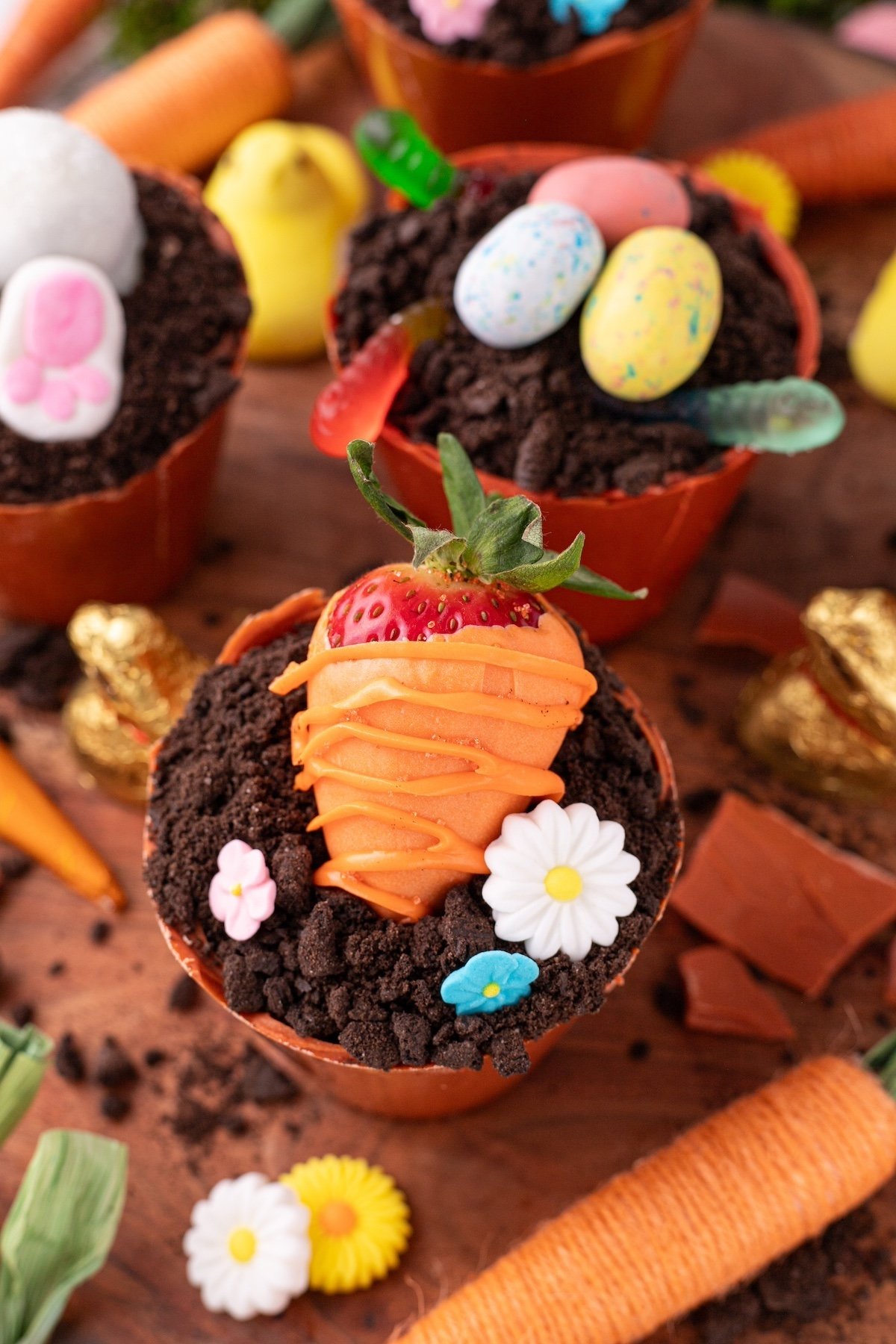 chocolate covered strawberry looking like a carrot on the flower pot cupcake