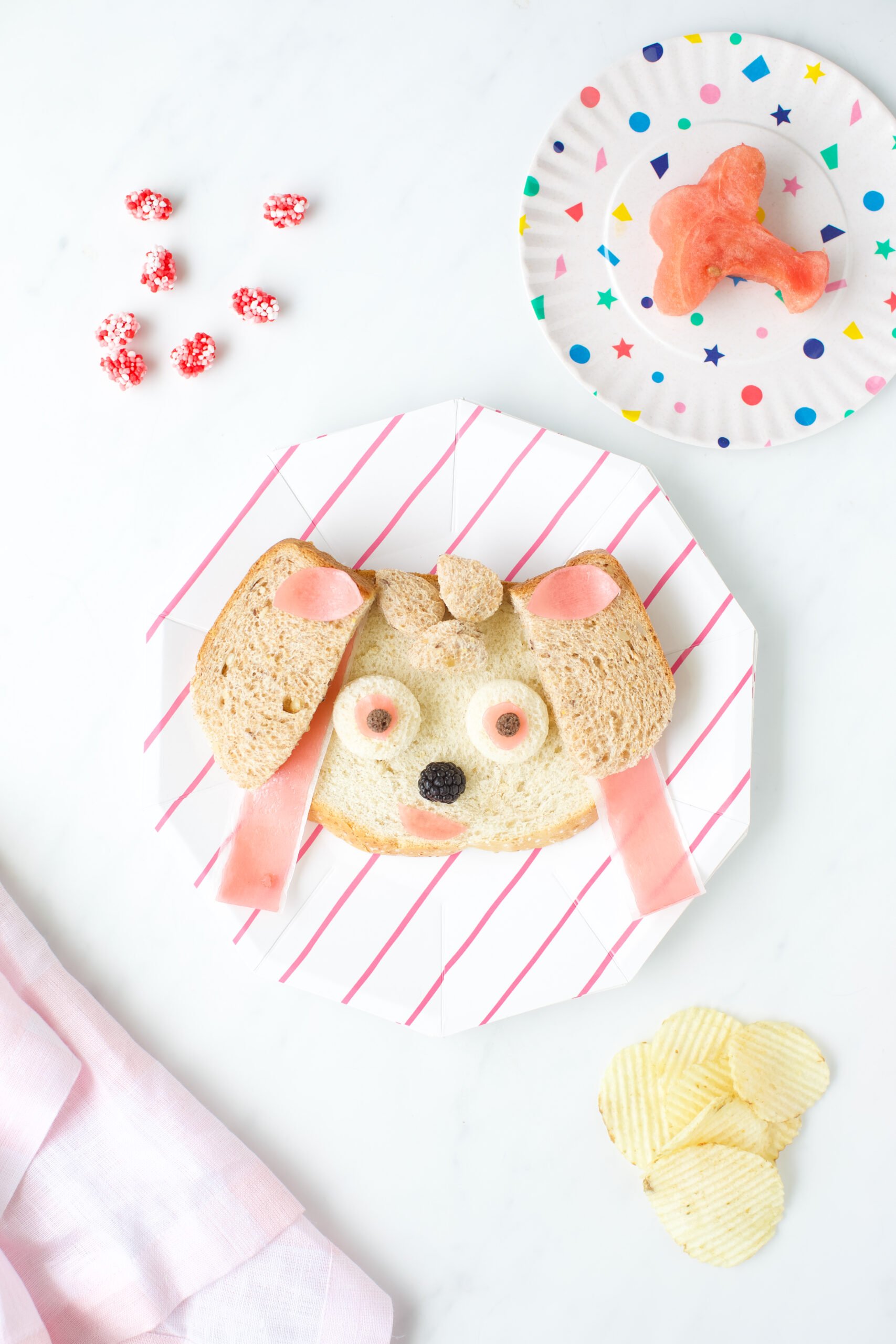 paw patrol show character skye sandwich made with bread, fruit and fruit snacks