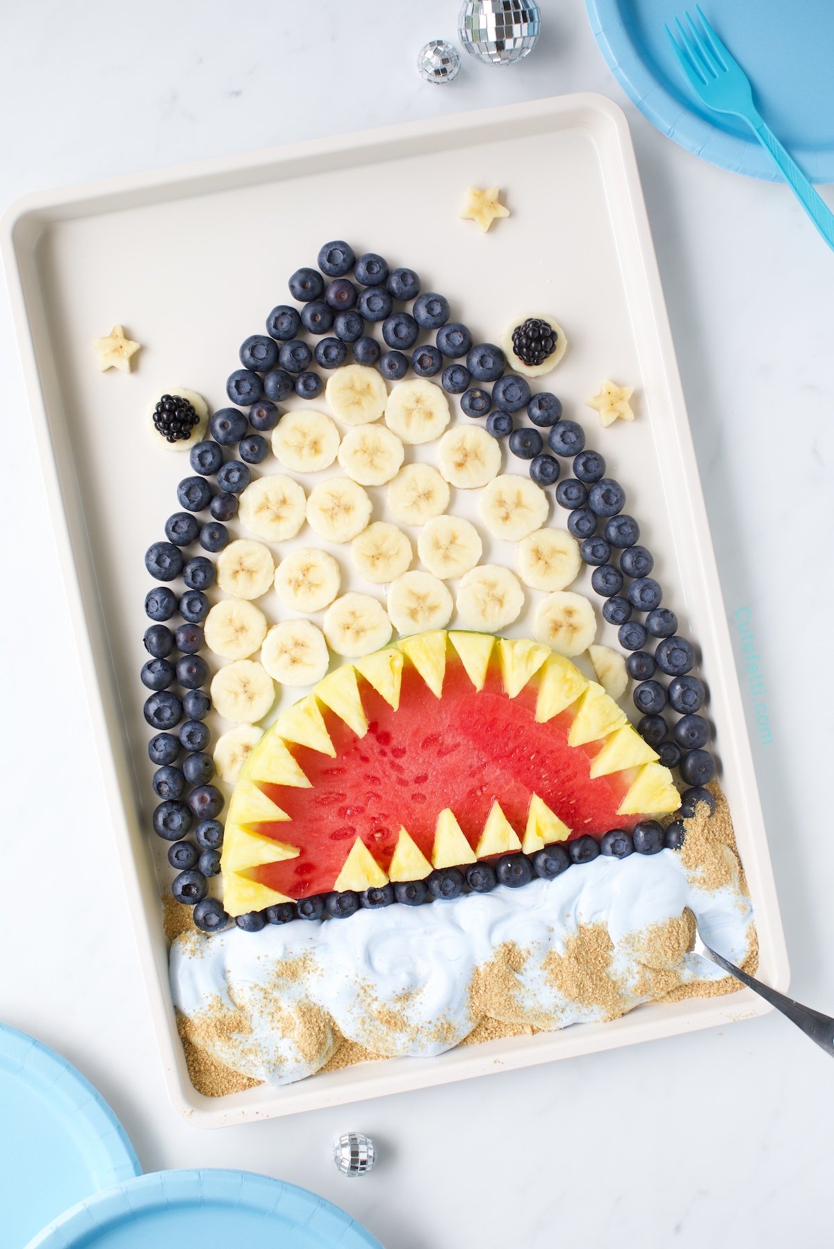 Shark fruit platter, fruit dessert that looks like a shark.