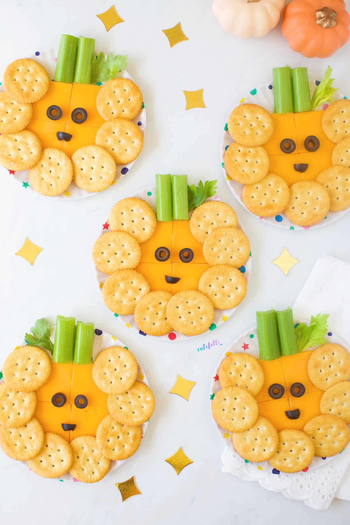 mini pumpkin cheese plates that look like jack-o'lanterns.