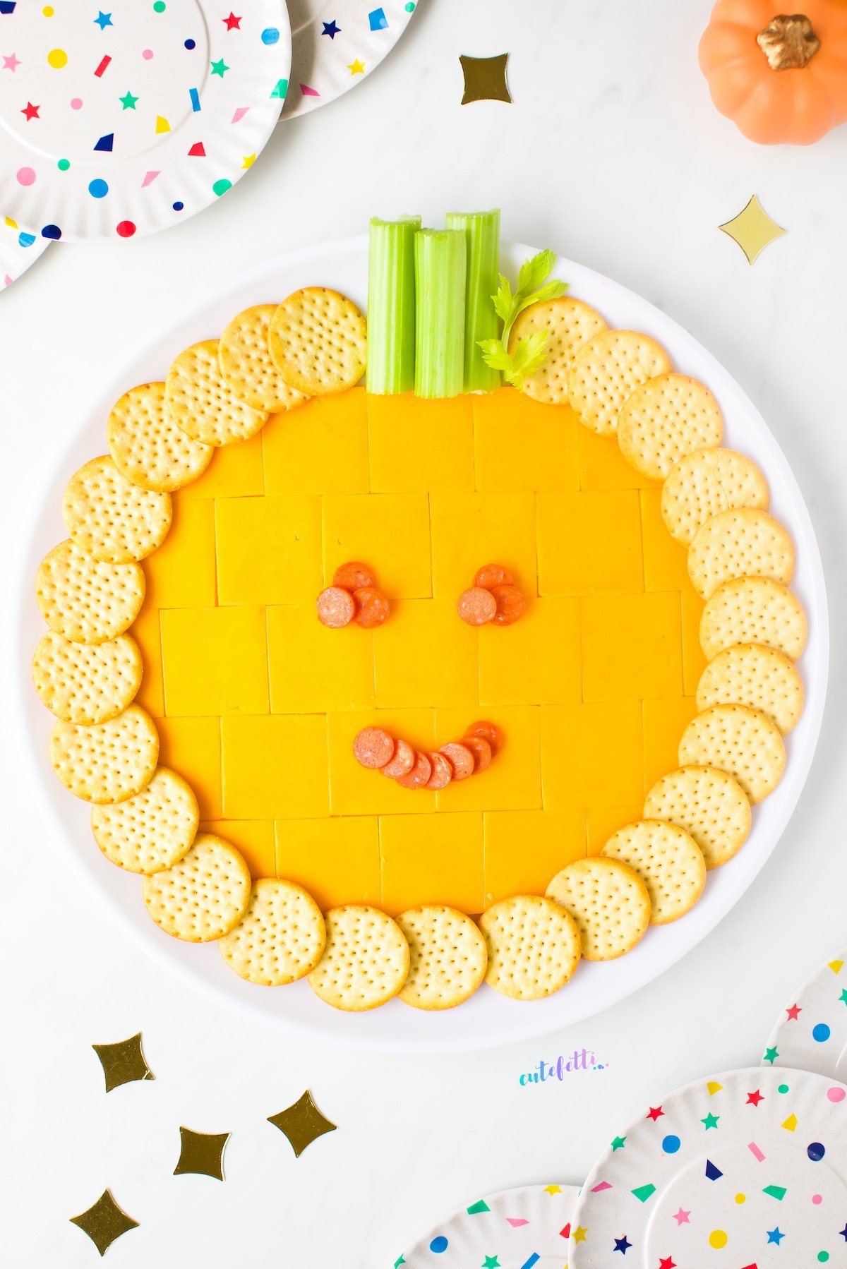 For fall entertaining, try a pumpkin cheese tray filled with cheddar cracker cuts, crackers, celery, and black olives.
