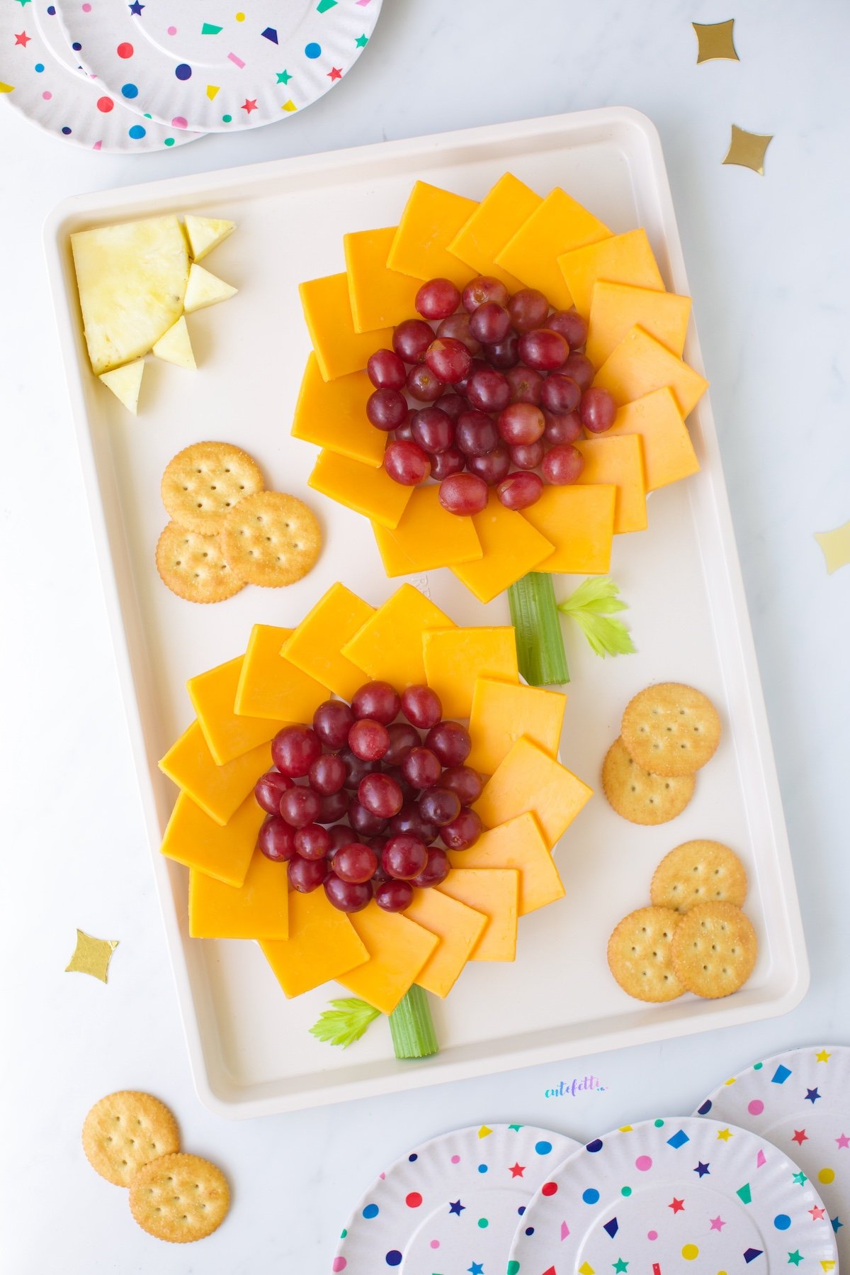 Sunflower Snack Tray with cheese, crackers and grapes. Cute pineapple sun.