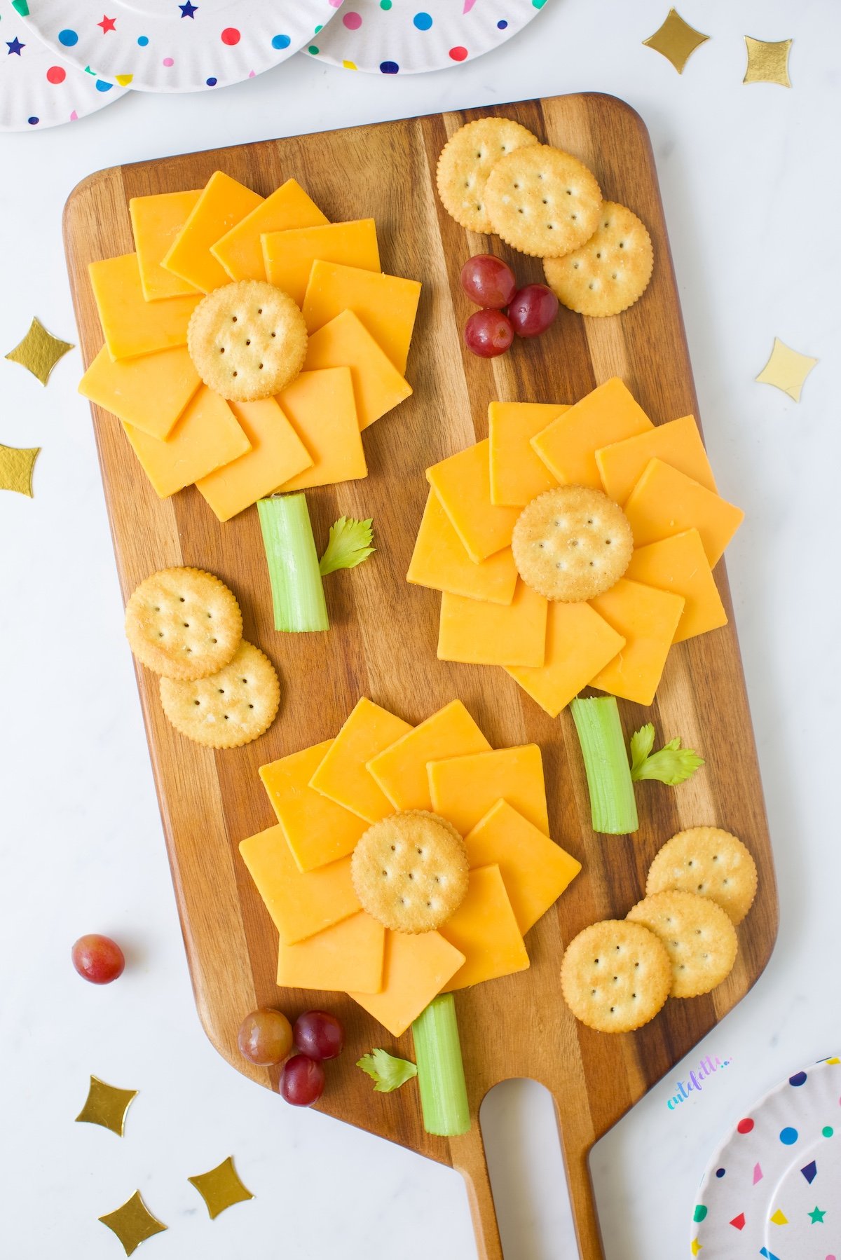 Cheddar Sunflower Garden on a wooden tray.