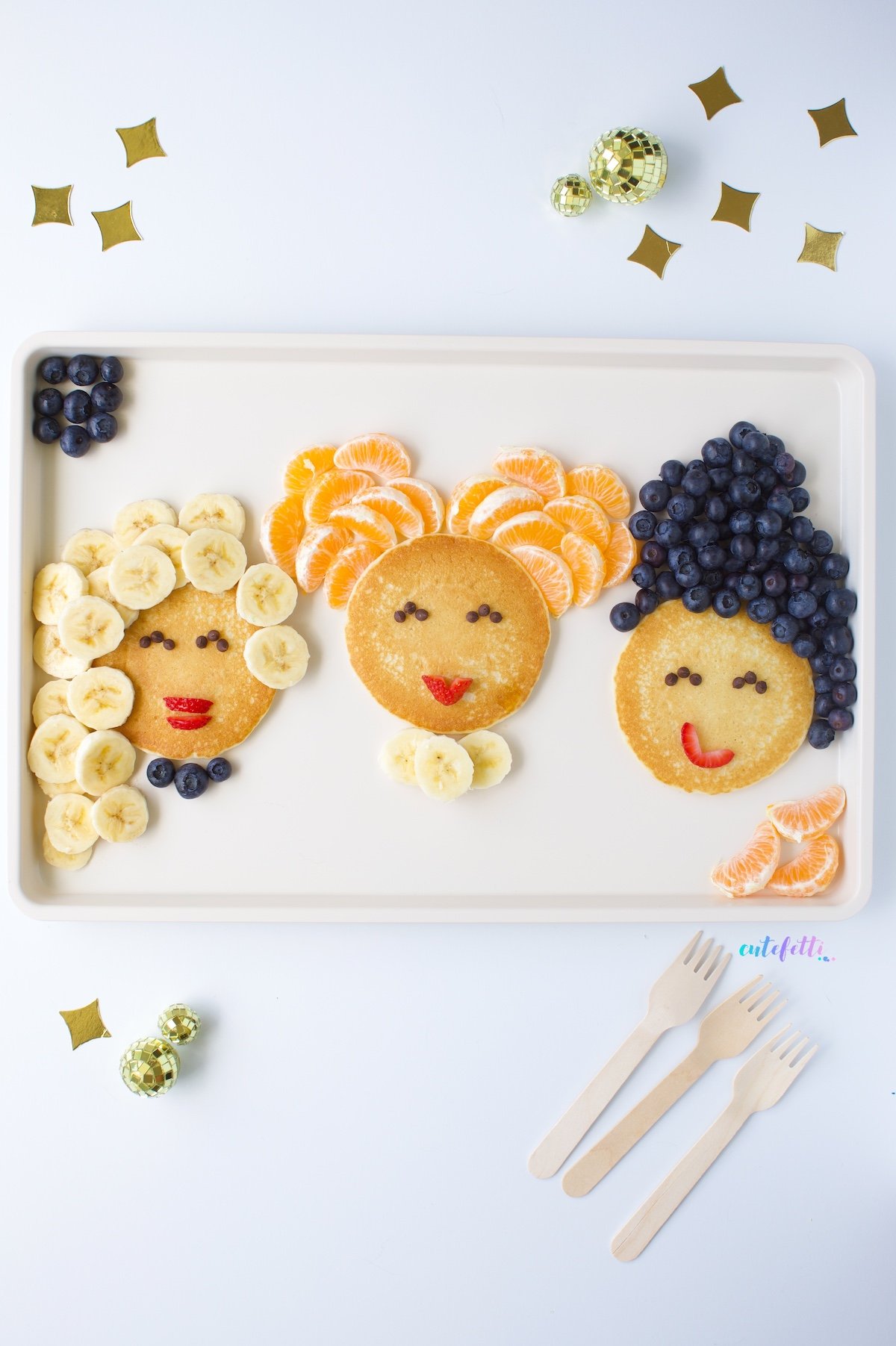 hocus pocus boards with pancakes decorated to look like the sanderson sisters.