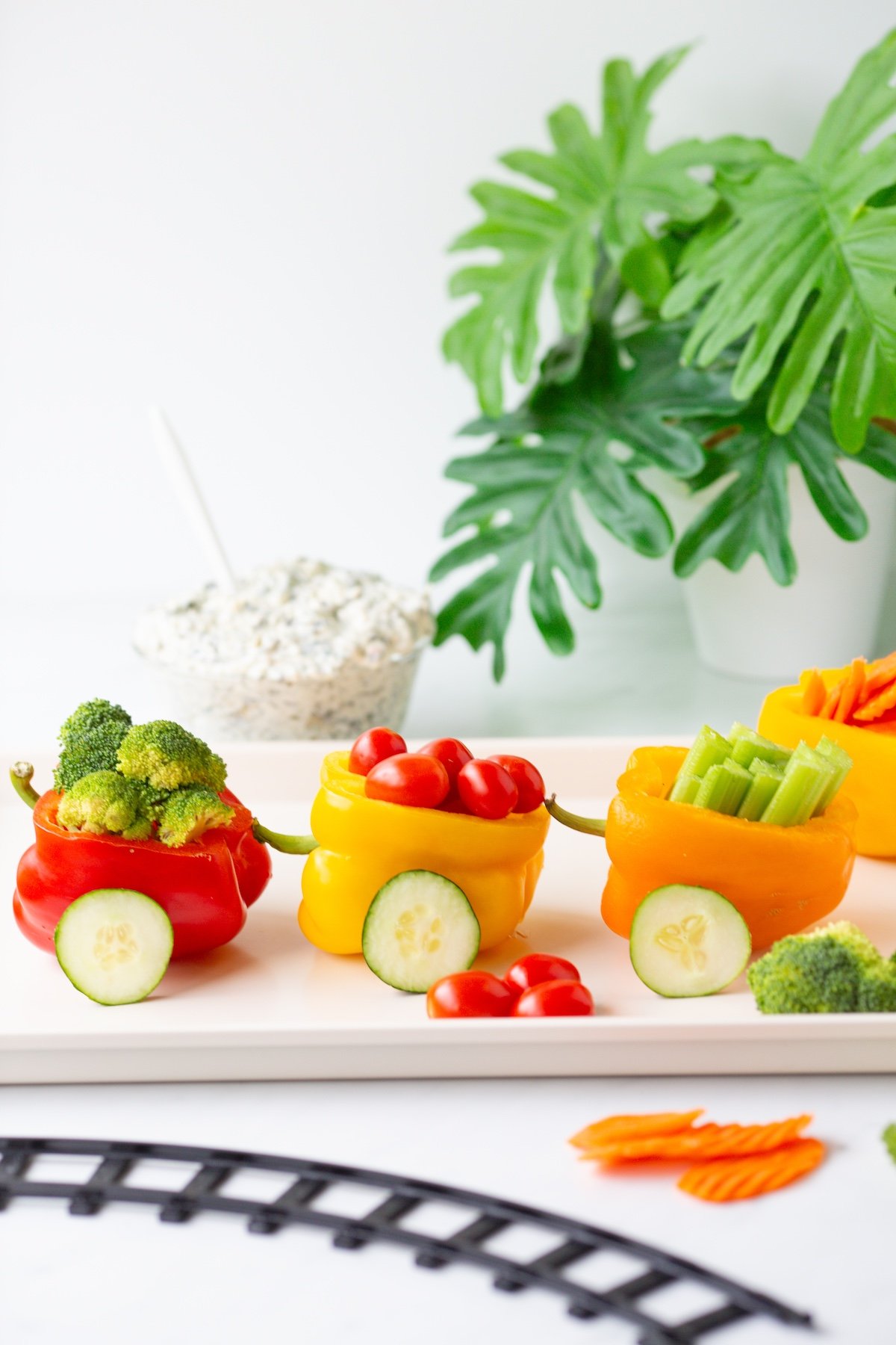 veggie train snack on a tray. cute kids snack with vegetables.